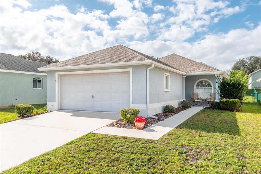 Enjoy golf-course living in the gated 55+ community of Ocala Palms! This warm and inviting 2-bedroom, 2-bath home offers 1,067 sqft of comfortable, low-maintenance living with laminate and tile flooring throughout and vaulted ceilings for an open feel.

The kitchen features ample cabinetry, generous counter space, stainless steel appliances, and a pass-through to the main living and dining areas. The primary suite includes tray ceilings, a walk-in closet, and a private bath with glass-door shower and extended vanity. A second bedroom and full guest bath offer flexibility for visitors or a home office.

Relax in the enclosed lanai/sunroom, and enjoy the convenience of a dedicated laundry room and attached two-car garage. Offered fully furnished, this home is move-in ready.

Ocala Palms residents enjoy a clubhouse, fitness center, indoor and outdoor pools, recreational facilities, 18-hole golf course, and Bella Cosa restaurant—all just minutes from shopping, dining, and major roadways. Ideal for full-time living or a seasonal retreat.