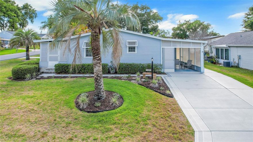 NO BOND! Welcome to this TURNKEY home (just a few dec items do not convey) with GOLF CART 2 bedroom, 2 bathroom home with a golf cart garage on the historic side of The Villages. This inviting home features a spacious living area with vaulted ceilings that create an open and airy feel. The kitchen offers newer stainless steel appliances (2023/2024) and a large peninsula with a breakfast bar, perfect for casual dining and entertaining. The primary bedroom includes a walk-in closet and an en suite bathroom with a walk-in shower. The second bedroom is generously sized with a built-in closet. Just off the living room, you’ll find a cozy lanai, while the screened-in carport area provides another peaceful space to relax, both featuring new screens installed in 2022. This home has been thoughtfully updated with a new 40-gallon water heater in 2024, a new Owens Corning Architectural roof in 2024, a new HVAC and heat pump in 2023, and a freshly painted and sealed driveway in 2023. All New vinyl siding on home with added foam insulation and Bahama shutters was installed in 2021, enhancing both curb appeal and energy efficiency. Conveniently located near shopping, restaurants, and UF Health Spanish Plaines Hospital, this home offers comfort, convenience, and the ideal Florida lifestyle.
