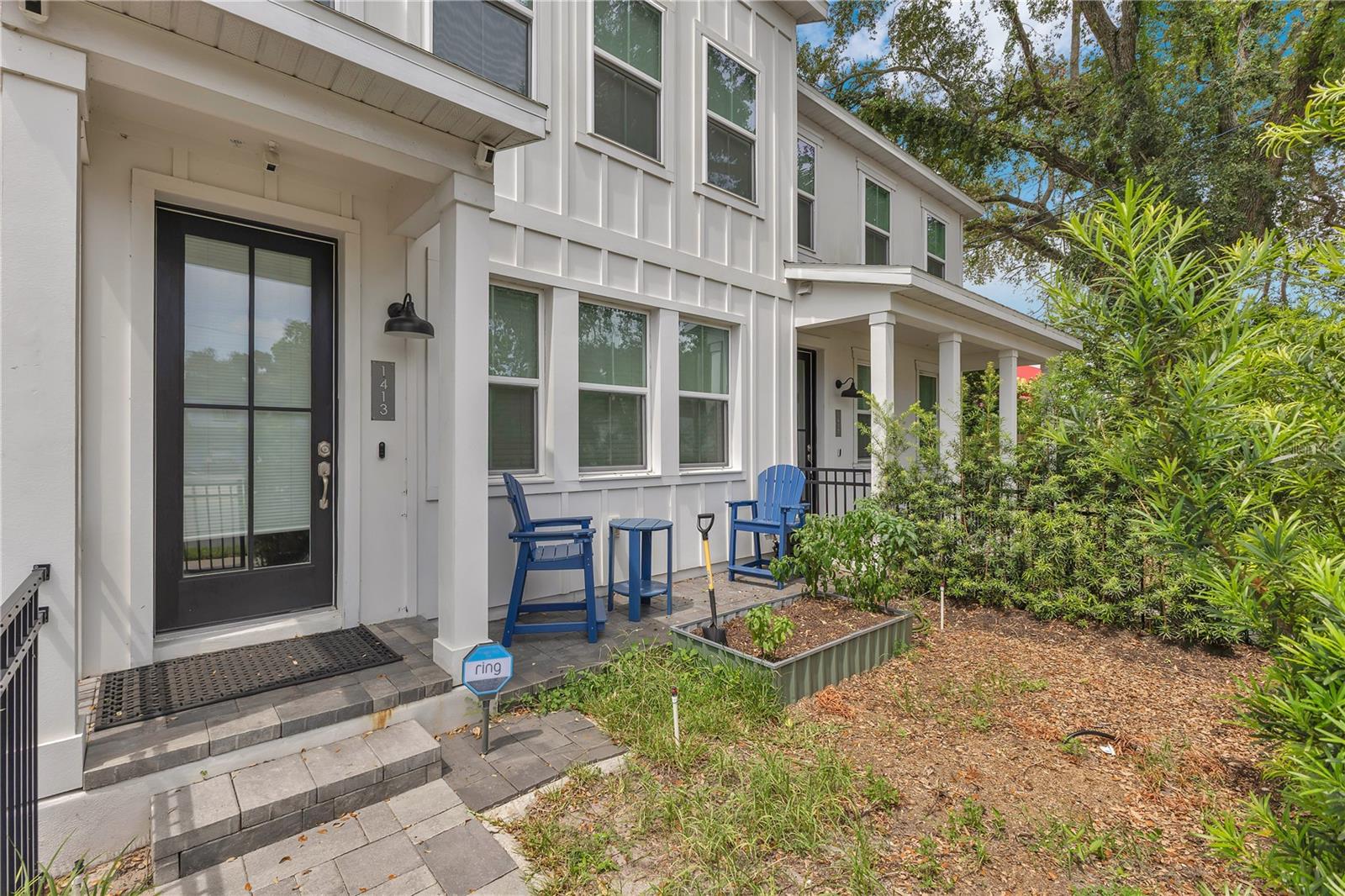 Prime location, low-maintenance, and designed for real life. Completed in 2021 and set minutes from downtown Orlando, this modern, like-new townhome keeps everything right at your fingertips — groceries, coffee spots, local dining, and major hubs like Orlando Health, Lake Davis, and the SoDo District. From weekday commutes to last-minute dinner plans at Tin & Taco or Fresh Kitchen, life here runs a little smoother — and a lot closer to everything you need. Step inside to over 1,700 square feet of crisp, modern living. The open-concept main floor is wrapped in wide plank engineered wood flooring—durable, water- and scratch-resistant—and filled with natural light. The kitchen anchors the first floor with quartz countertops, a large island, stainless steel appliances, modern fixtures, and a walk-in pantry, all overlooking your dining and living areas. A half bath and additional storage make everyday living feel effortless. Upstairs, the oversized primary suite spans nearly 20 feet wide and features a walk-in closet and en suite bath with a dual sink vanity and a custom glass shower. Two additional bedrooms, a second full bathroom, and a dedicated laundry room round out the second floor. Out back, a paver driveway leads to the private two-car garage, upgraded with granite flooring and wall-mounted storage systems. The HOA takes care of lawn maintenance and the roof, so you can worry less and spend more time enjoying the unbeatable location. Zoned for highly sought-after Blankner K-8 and Boone High School (Go Braves!), this townhome delivers access to top-tier public schools in one of Orlando’s most connected locations. With walkability, workability, and weekend fun all at your doorstep—this is the kind of city living that’s hard to find and makes everyday living feel like a win.