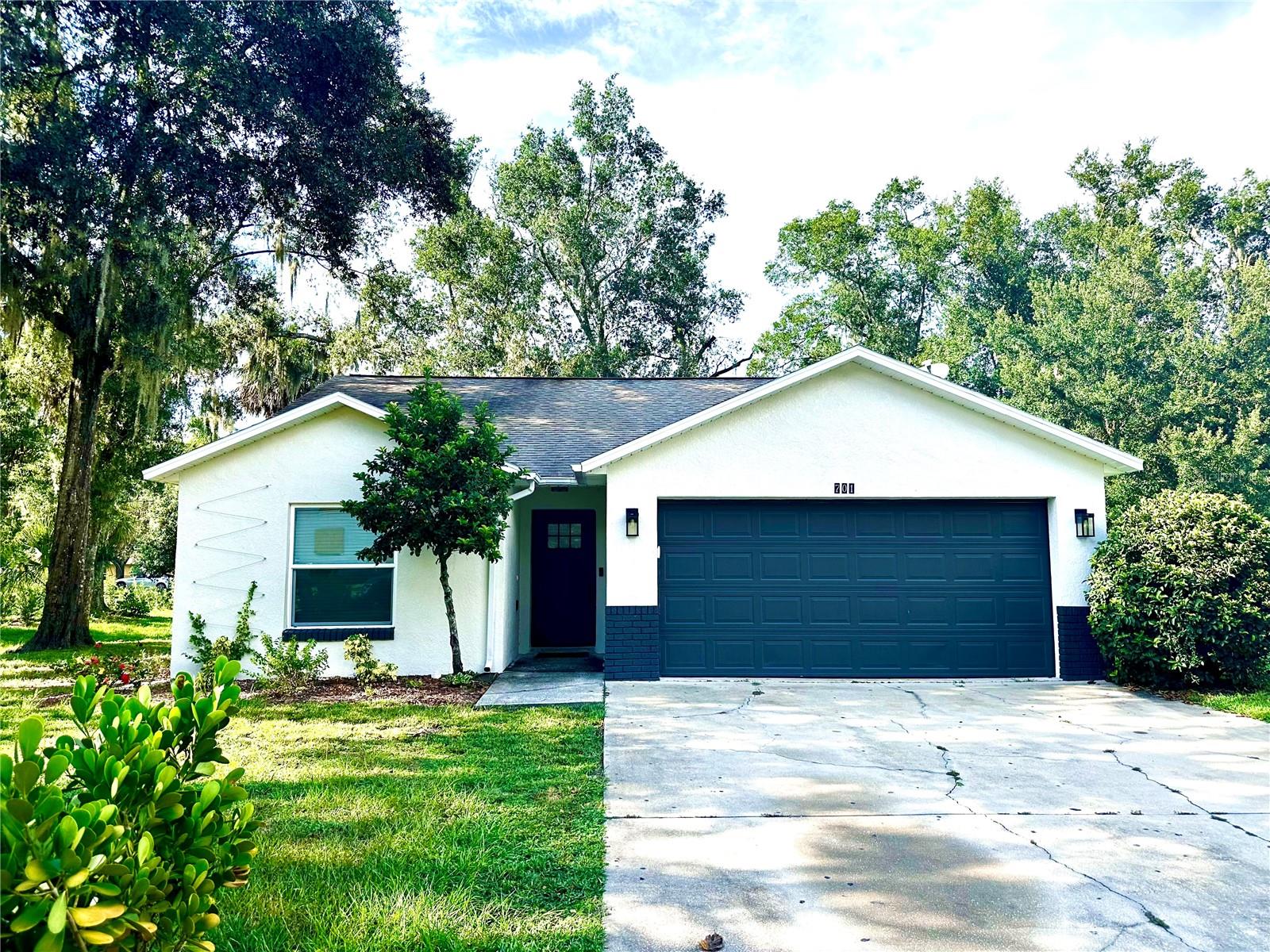 This charming single-family home features a 3-bedroom, 2-bath split floor plan and a prime central location blocks from downtown Mount Dora. Enjoy the easy access to major highways, schools, parks, and restaurants. This home features an updated kitchen with stainless steel appliances, a separate dining area, and a spacious master bedroom with a walk-in closet. The modern master bathroom is finished with modern tiles, while the large backyard is perfect for gatherings and entertaining. Additional highlights include a generous driveway and a 2-car oversized garage, offering both comfort and convenience. Act now! This one won't last long! All applicants are required to do a credit and background check. Renters insurance is required. Furnishings are optional.