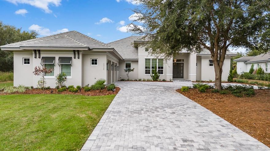 Located in the guard gated golf community of Bella Collina, this single-story custom home is one of kind and move-in ready.
Positioned on a private one-way street with no front or rear neighbors, this home offers a SW facing backyard on a 1.3 acre preserve site. 
The open floor plan greets you with high ceilings and 10 ft sliding pocket doors that lead seamlessly to the expansive lanai, outdoor kitchen, and pool deck. Remote-controlled screen enclosures enhance the outdoor living and entertaining experience. A chef’s kitchen with Sub-Zero built-in wall oven and microwave, 5 burner gas range with plenty of countertop space and custom cabinetry overlook the great room. Large porcelain tiles throughout the home provide for low maintenance and a continuous flow from room to room. Natural earth tones throughout, provide a calm home ambiance.  The spacious master suite offers his and hers walk-in closets, an ensuite bathroom with double vanities and large walk-in shower with built in benches and separate soaking tub.  The guest suite is perfect for in-laws or visiting guests with its own patio and side entrance. The large home office and yoga room can easily be converted to a game room or additional bedrooms. The 3-car upgraded garage offers built in custom workstations, storage and mini split AC. All furnishings are available for purchase. Enjoy a round of Golf on the  Nick Faldo designed 18-hole championship golf course or wind down with a Soothing massage at the Spa.  The Club at Bella Collina amenities include Har Tru tennis courts, outdoor pool complex, pickleball, fitness center, free fitness classes along with year-round social and culinary events for the entire family. Call today to set your private preview appointment. Bedroom Closet Type: Walk-in Closet (Primary Bedroom).