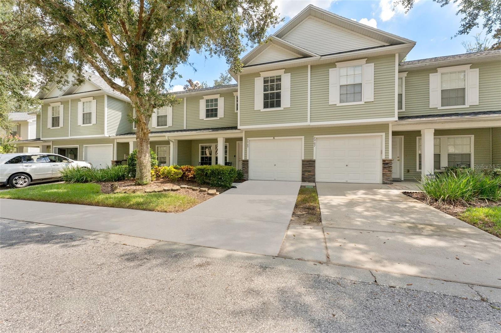 Welcome to Oakwood Terrace Townhomes! This beautifully maintained 2 bedroom, 2.5 bathroom townhome offers 1,461 sq. ft. of comfortable living with a one-car garage. The open floor plan features luxury vinyl plank flooring downstairs, fresh paint, and plenty of natural light. The kitchen has been updated with granite countertops, stainless steel appliances, white shaker cabinetry, and a glass tile backsplash, opening seamlessly to the dining and living areas.
Upstairs you’ll find spacious bedrooms, including a primary suite with his and hers (walk-in) closet with a fully renovated bath showcasing modern double vanities and a walk-in shower with elegant black marble tile. A screened lanai provides the perfect space to relax while overlooking a quiet green space. Additional highlights include newer roof (2024), new refrigerator (2024), new carpet (2022), updated master bath (2022), extended driveway, and low-maintenance living with exterior upkeep covered by the HOA.
Oakwood Terrace is a sought-after community with amenities including a resort-style pool, cabana, and manicured grounds. Conveniently located near shopping, dining, schools, and major highways, this home offers both comfort and convenience in the heart of Valrico.
