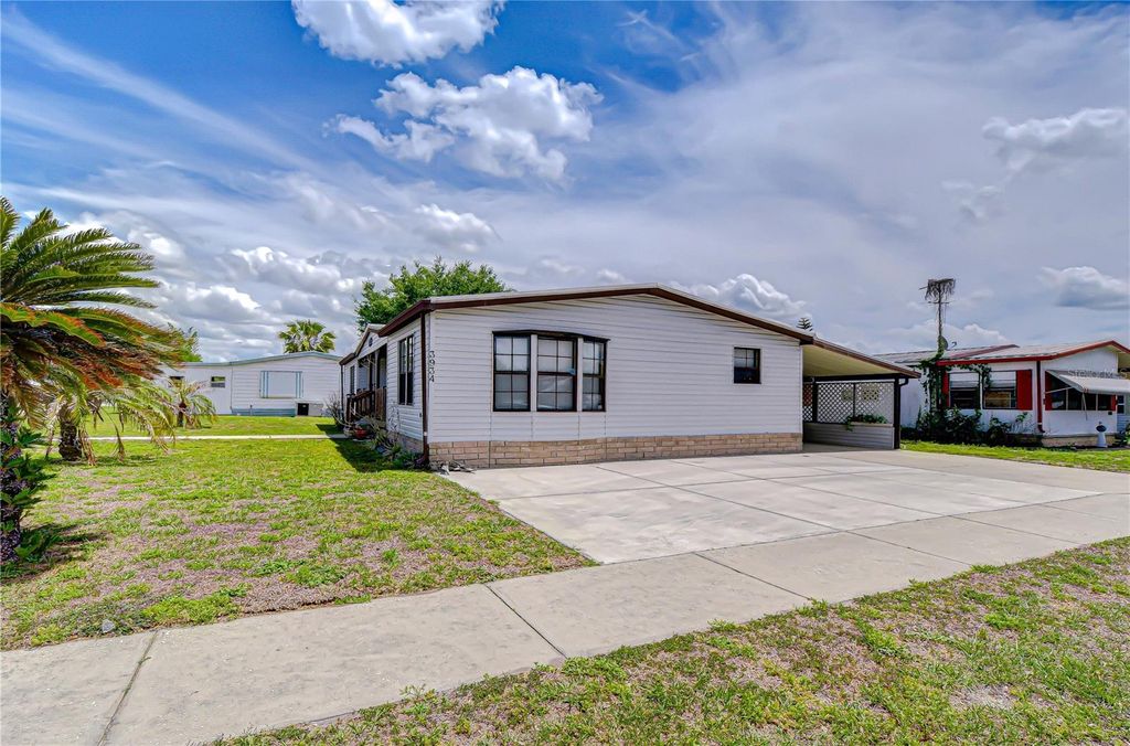 Photo of 3934 Sarah Drive, Wesley Chapel, FL 33543 (MLS # TB8500090)