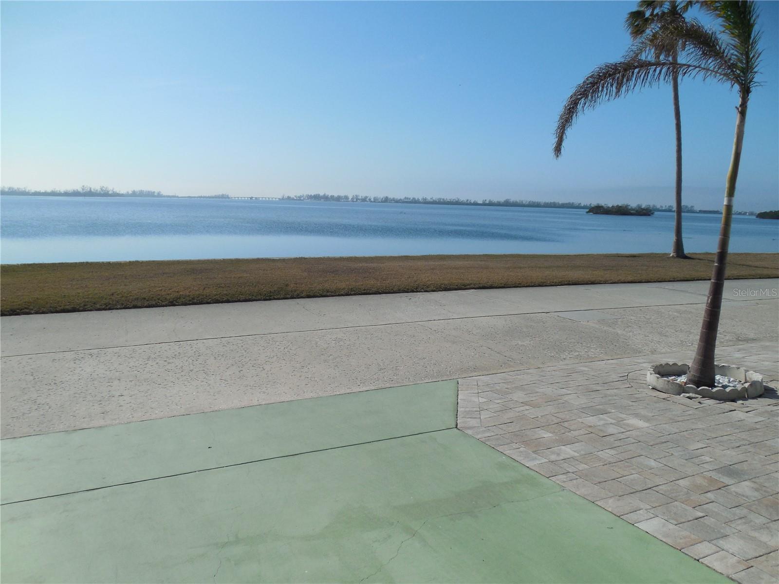 You can sit in the Florida Room and can see all the way to south end of Anna Maria Island and Long Boat Key bridge, including intracoastal waterway. Full view of sunrise to sunset, as it faces south. Watch the dolphins swim and birds dive for fish. Upgraded and EVERYTHING included and we mean everything including furniture, dishes, etc. All new vinyl siding and windows 8 years ago - Florida room with vinyl siding window, commercial grade carpet all new rubber membrane roof done 3 years ago - 8x6 Shed under carport for washer and dryer. New 8x8 shed for additional storage. There is also a Brand new A/C unit in 2024 - READY TO MOVE IN