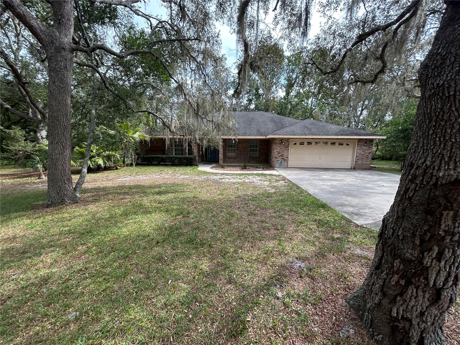This home is in the Country but less than 5 minutes to Saxon & Enterprise in Orange City. You can have the country and city life on this 2.8 parcel. This property is private with Oak Trees surrounding a 1991 built brick home. The home is dated but very livable. The office could be a 4th bedroom if more bedrooms are needed. The shed and a detached garage are rough. Enter at your own risk.