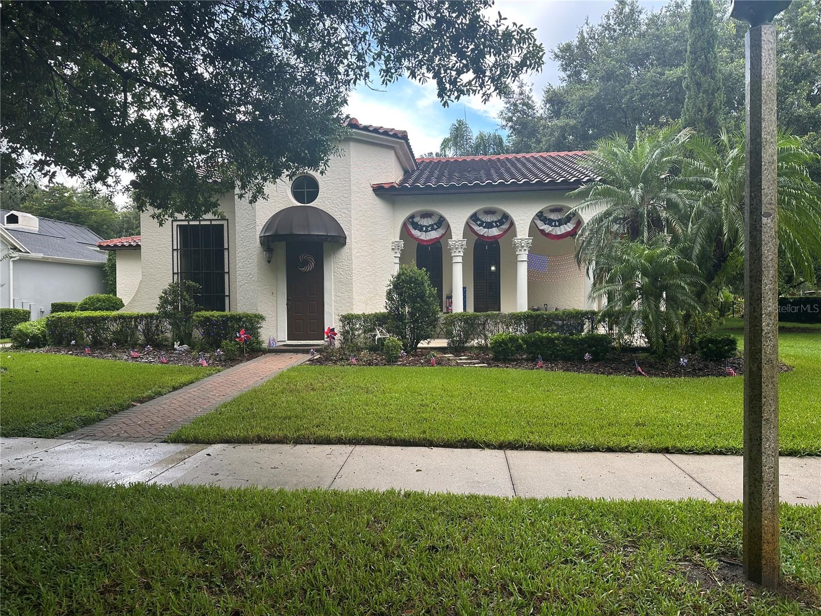 Welcome to 1423 Stickley Avenue, a stunning UNFURNISHED 4-bedrooms with walk in closets, 3-bathroom home located in the vibrant community of Celebration, FL. This single-story gem boasts a spacious layout with large bedrooms, a formal dining room, and a gourmet kitchen that will inspire your inner chef. The home features wood flooring throughout, adding a touch of elegance and durability. The exterior is just as impressive with patio pavers leading to a fenced yard, perfect for outdoor entertaining. Every room is expanded. Custom gazebo with fireplace and swing is nested inside a lush tropical garden with black metal fence. The house is located within the highly sought after Artisan Park section of Celebration, and is ideally situated within a short walking distance from the beautiful clubhouse with salt water pool, gym and well managed dining services. An outdoor BBQ is ready for your summer cookouts, and the home's proximity to a park expands your recreational options. The attached 3-car garage with side drive offers ample parking and storage space. Enjoy the charm of a front porch and the benefits of living in Celebration with access to all its amenities. Please note, the estate-sized lot does not include the garage apartment. This home is a perfect blend of comfort and style, waiting for you to make it your own.