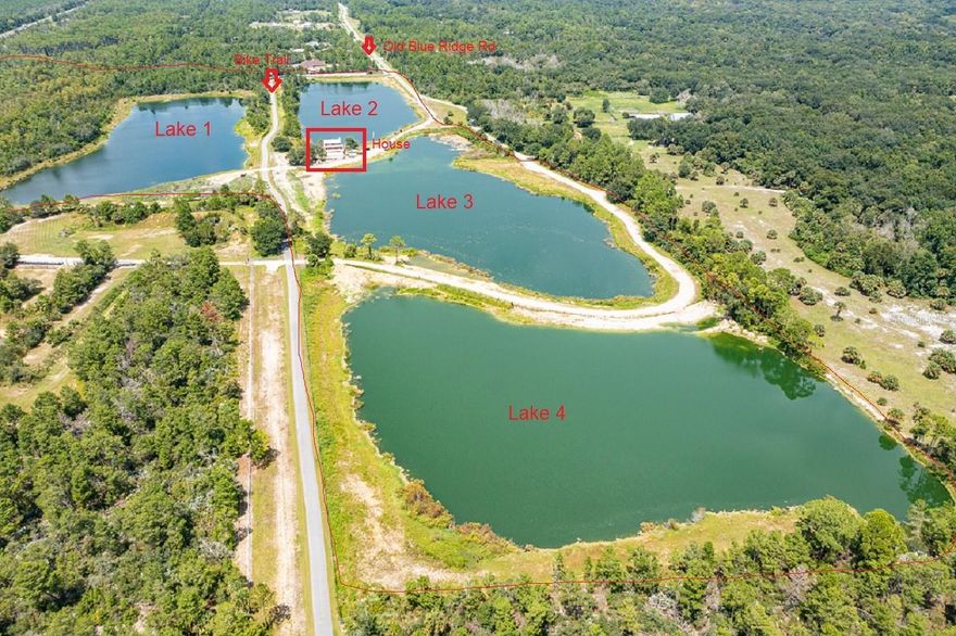 BACKUP OFFERS ARE WELCOME.. APPRAISAL AND SURVEY HAVE BEEN COMPLETED.   WATERFRONT home on 60 ACRES with 4 private LAKES.  Views from every angle of the home overlook crystal blue fresh water.  The 4 bedroom 3 bath home with log cabin exterior offers hard wood floors, cathedral ceilings, loft, granite counters, and new metal roof in 2016. Downstairs has additional living space with kitchenette, bedroom, bath and office.  Accessory metal building with concrete floors and 2 garage doors offer additional storage space for your equipment or toys.  Currently property is classified as fishery and has many species of fish in the lakes including Tilapia, Bass, and more.  The shell bottomed lakes offer pristine clear blue water and are a source of entertainment or relaxation, whichever you may choose.  Located off of highly sought after Cow Creek Rd in Edgewater just off I-95 and only moments to the beach and river.  This property can only be accessed by appointment.