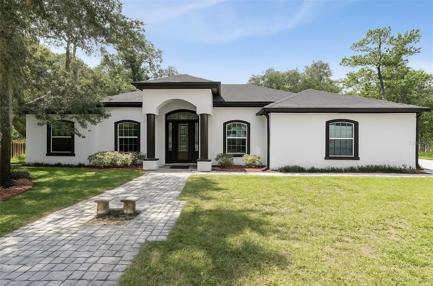 One or more photo(s) has been virtually staged. MULTIGENERATIONAL PROPERTY set on over 1/2 ACRE LOT with NO HOA!!! Beneath the shade of majestic oak trees, this 5-bedroom, 4-bathroom ONE STORY home combines classic charm with modern resort-style amenities. Step inside to find soaring 12-foot ceilings, expansive sunlit living spaces, and a split floor plan designed for both comfort and privacy.

The primary suite feels like its own private sanctuary, complete with two walk-in closets, an oversized bedroom, and a spa-inspired bathroom featuring a jetted soaking tub and generous layout. Every bedroom offers 10-foot ceilings, creating a sense of openness throughout.

Slide open the triple glass doors and step into your personal outdoor retreat: a screened-in patio spanning more than 400 sq. ft. with 12-foot ceilings, sparkling POOL & HOT TUB, and a fully equipped OUTDOOR KITCHEN with its own bathroom and shower—perfect for entertaining guests with ease.

With NO HOA restrictions, you’ll have the freedom to enjoy this property however you wish. You can even convert the outdoor shed into an ADU or DETACHED MOTHER IN LAW SUITE! This home has endless opportunties to create a MULTIGENERATIONAL Property! Whether you’re sipping morning coffee under the oaks or hosting lively gatherings poolside, this home was built for both everyday comfort and memorable moments. All of this in a prime location close to shopping, dining, and TOP-RATED SCHOOLS! This home won't last long- schedule your showing today!