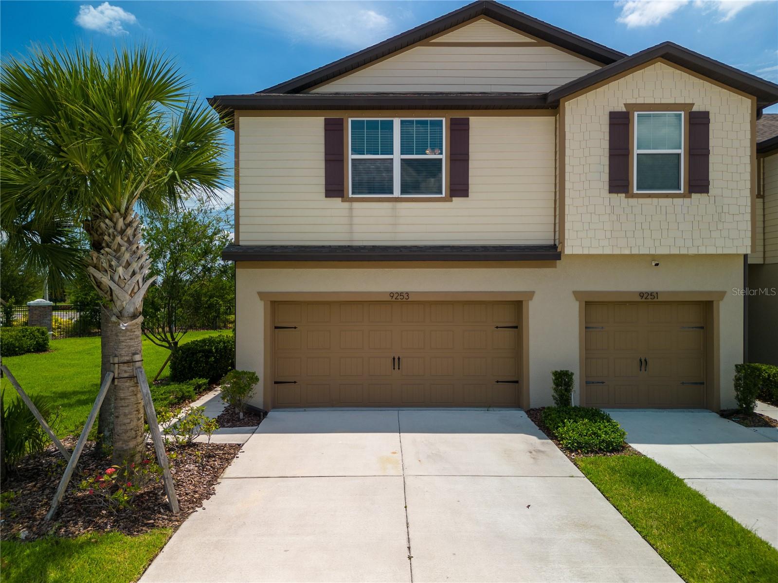This stunning corner lot property offers the perfect blend of modern design, comfort, and convenience. Located in the desirable Magnolia Park community, this home is an ideal choice for those seeking a peaceful community with great amenities. This 2018 built townhome has thoughtfully designed interior spaces and impressive features that are sure to exceed your expectations. As you step inside, you'll be greeted by a spacious and inviting floor plan that leads you into the heart of the home. The open-concept living area is bathed in natural light and features soaring ceilings, creating an airy and bright atmosphere with recently added Plantation shutters on the sliding doors. The living room is perfect for relaxation or entertaining guests, while the adjacent dining area is well-suited for hosting memorable dinner parties. The kitchen is a dream come true, equipped with stainless steel appliances, ample shaker-style cabinetry, a spacious pantry, and a large center island. Whether you're preparing a quick meal or indulging in culinary creations, this kitchen provides the perfect space to showcase your skills.
The large primary bedroom is a true sanctuary and boasts a generous layout, a walk-in closet, and an en-suite bathroom with dual vanities and a walk-in shower. Two additional bedrooms provide comfort and privacy for family members or guests. The washer and dryer are also located on the second floor making laundry a breeze. The outdoor space is equally impressive, featuring a spacious backyard with lush landscaping. It's the perfect spot for outdoor gatherings, barbecues, or simply enjoying the Florida sunshine. The covered patio provides a shaded area where you can relax and unwind. With several walk-in closets throughout the home and a 2-car garage, you'll have plenty of storage! The gated community of Magnolia Park features 3 community pools, 2 playground areas, a basketball court, and walking paths throughout. Conveniently located, this home offers easy access to a wide range of amenities and attractions including Publix, AMC, Target, and Costco. With easy access to the expressway, you're just 15 minutes away from downtown Tampa.
Don't miss the opportunity to make this exquisite property your home. Schedule a showing today and experience the best of Magnolia Park living at 9253 Hillcroft Dr.