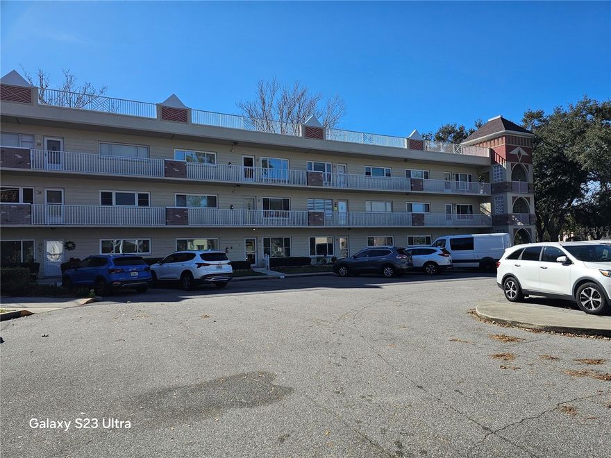 Welcome Home to Your Move-In Ready 2-Bed, 2-Bath ground floor Sanctuary! Nicely located just a couple of blocks from the West Activity Center and Harbor Lake, this condo offers comfort, convenience, and a vibrant 55+ lifestyle. With resort-style amenities, including a heated swimming pool, jacuzzi, computer center, and billiard room with 10 pool tables. Step inside to discover beautiful light vinyl and tile flooring throughout the extra-large living and dining areas, kitchen, and Great Room. The Kitchen is very spacious with a generous pantry closet and is opens into a Florida room that has an entrance into the master. Relax in the inviting Great Room and enjoy serene views of trees and lush green lawns through the updated windows. The private primary suite includes an ensuite bathroom with a large vanity and new washer dryer. There are ceiling fans throughout for year-round comfort. There is a covered back patio with fence. This active 55+ community is packed with amenities to enhance your lifestyle: two private golf courses (9 and 18 holes), two heated swimming pools, and two activity centers. Stay fit in the remodeled Cardio Gym, join fitness classes or dance sessions, and take part in clubs, cards, billiards, and more. Perfectly located near beaches, shopping, dining, entertainment, and transportation. 1 Small pet allowed.