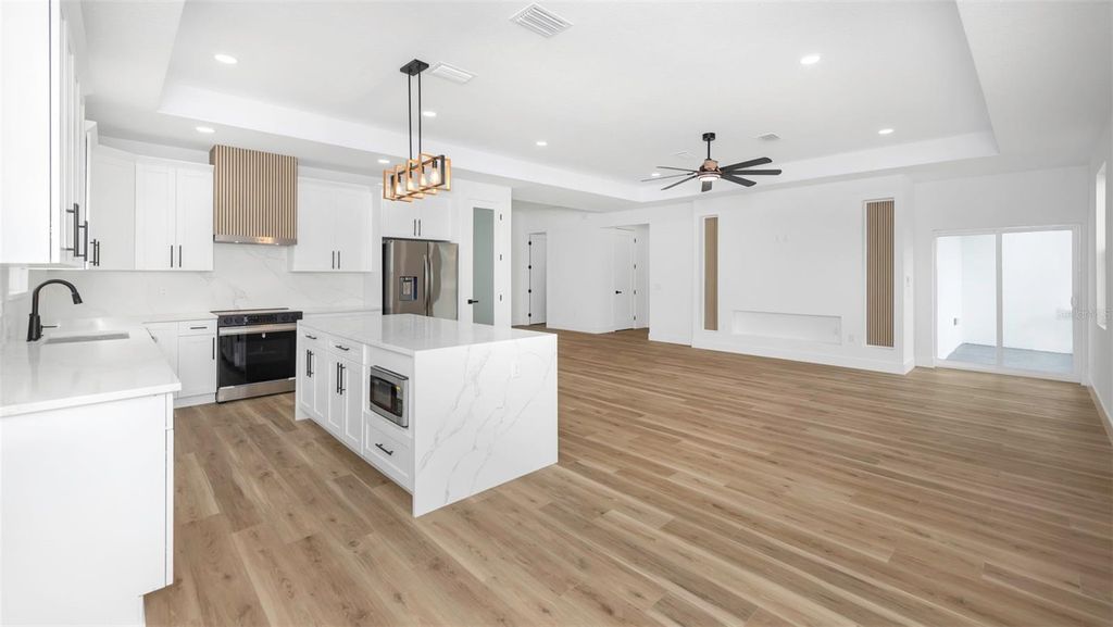 Photo of 303 Archimedes Street, Dunedin, FL 34698 (MLS # TB8467416)