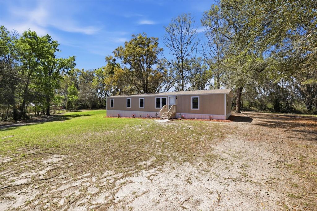 Photo of 9015 SW 135th Place, Archer, FL 32618 (MLS # TB8488118)