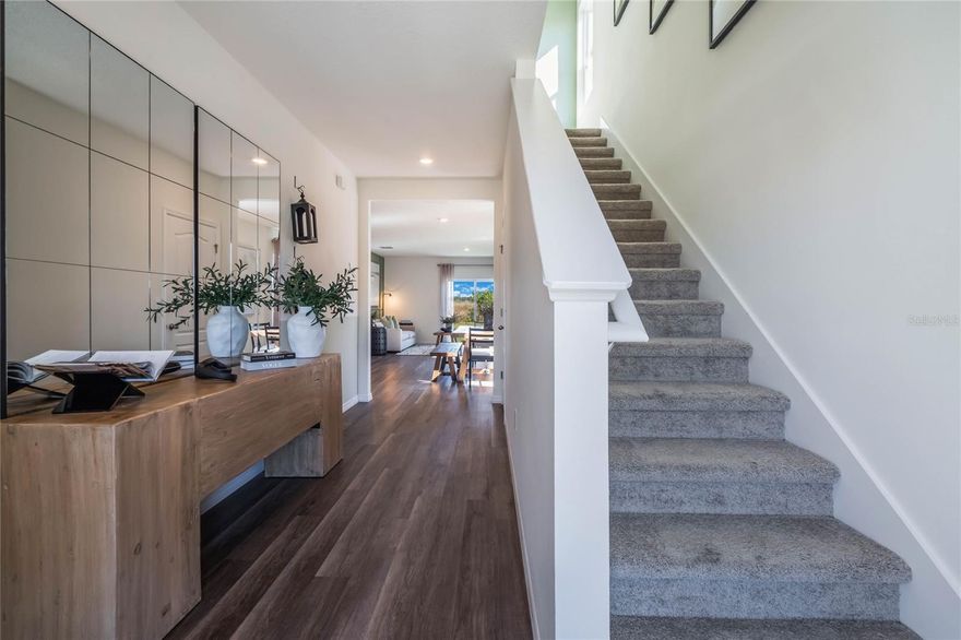 Under Construction. Wynnstone, located minutes from Posner Park and I-4, showcases The Robie, a two-story concrete block plan featuring a spacious open-concept home. First floor which includes a well-appointed kitchen with sleek stainless steel appliances, quartz countertops, huge pantry and oversized island that overlooks the dining room which opens to the living room. Also downstairs you will find a spacious bedroom, ideal for guests or a home office and full bathroom with a wall in shower. As you move upstairs you are greeted with a spacious landing/loft space to utilize for work or play. To the right you find an exemplary primary suite that includes a spacious walk-in closet as well as en-suite bathroom with double vanity. To the left are three additional bedrooms that share a second upstairs bathroom with double vanity. Also upstairs is a linen closet for extra storage and the laundry room. Like all DR Horton homes, the Robie includes a Home is Connected smart home technology package which allows you to control your home with your smart device while near or far. *Photos are of similar model but not that of the exact house. Pictures, photographs, colors, features, and sizes are for illustration purposes only and will vary from the homes as built. Home and community information including pricing, included features, terms, availability, and amenities are subject to change and prior sale at any time without notice or obligation. Please note that no representations or warranties are made regarding school districts or school assignments; you should conduct your own investigation regarding current and future schools and school boundaries.*