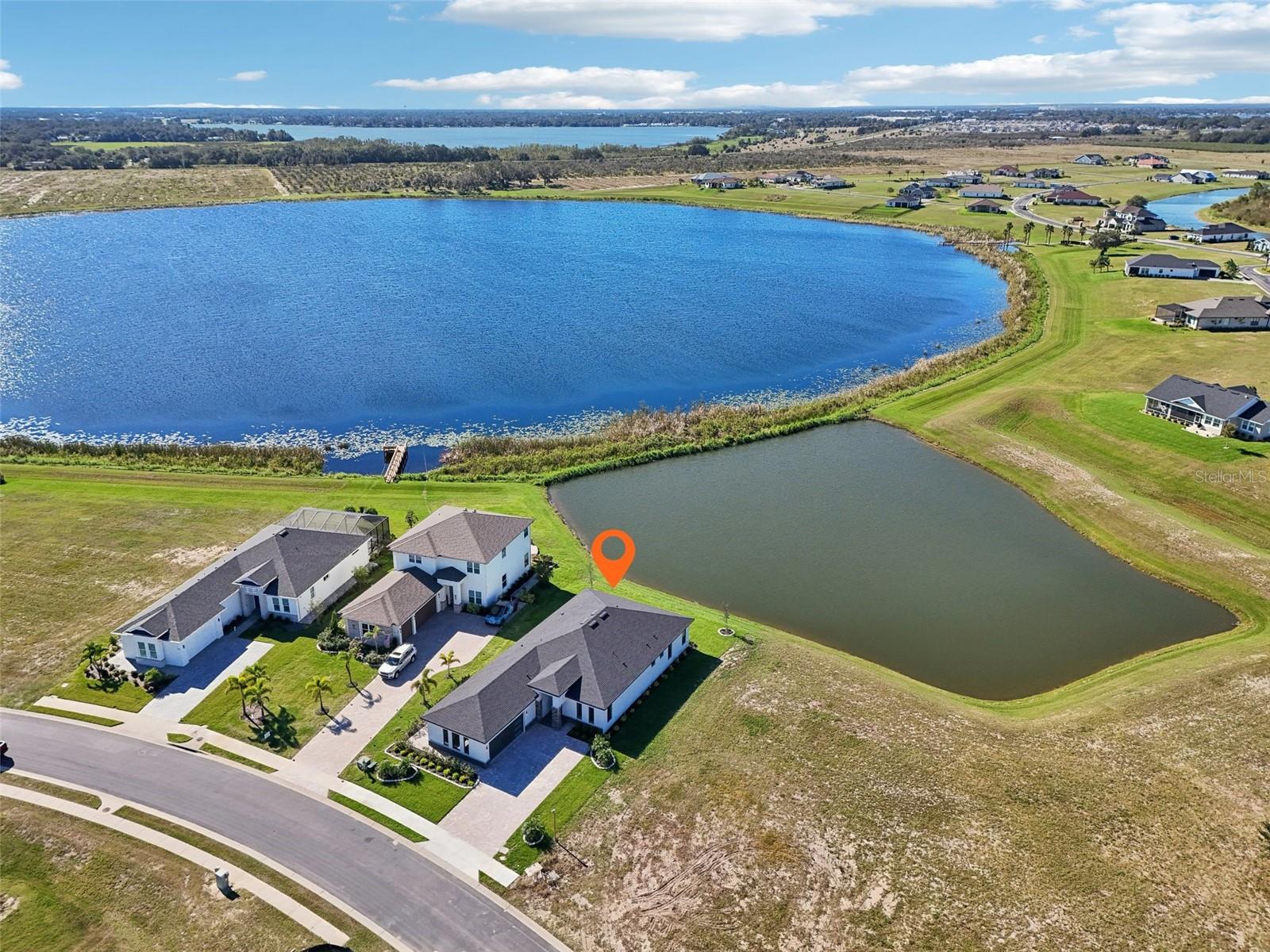 A stunning, New Construction residence perfectly positioned on a premium lot with sweeping, unobstructed views of tranquil Lake Medora. This thoughtfully designed 4-bedroom, 3-bathroom home offers a unique blend of comfort, flexibility, and upscale living that truly sets it apart from anything else in the WR market.
From the moment you arrive, you’ll be captivated by Lake Medora view, but it’s the inside that truly impresses. The spacious, open-concept layout is loaded with high-end upgrades and designer finishes that elevate every room. Gleaming floors, custom wood cabinetry, sleek Quartz countertops, and top-of-the-line GE stainless Steel appliances come together to create an inviting yet refined living space.
One of the standout features of this home is the versatile 4th bedroom suite, complete with its own private entrance—ideal for multi-generational living, guests, a home office, or even rental potential. Whether you're hosting family or seeking added privacy, this flexible space adapts to your lifestyle needs.
Wake up to lake views and the sense of peace that only this rare setting can provide. Entertain with style, complemented with the upscale Water Ridge community and its resort style amenities and access to 2 lakes and endless water sports possibilities. This isn’t just a home—it’s a lifestyle upgrade. Just 35 min away from Disney. 45 Min away from Orlando International Airport.