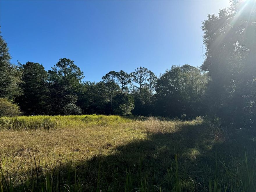 Nestled within the quiet neighborhood of Ocala Estates in Ocala’s NW region, this parcel is a wonderful opportunity for those looking to be close to everything the area has to offer. Nicely cleared with mature cedar and pine trees still in place along the perimeter, this parcel offers just under an acre of space. This is an ideal option for those looking to build their home from the ground-up, with no HOA or deed restrictions in place to allow for plenty of flexibility in your design. Wire fencing is currently in place around the perimeter for added privacy. Ocala Estates is a rapidly developing community with a highly convenient location just off of State Route 40, allowing for easy travel into Ocala or nearby Dunnellon. With the World Equestrian Center less than 10 minutes away and HITS just a short 14-minute drive, this parcel is perfectly positioned and would serve well as a year-round residence that captures the vibrant Ocala lifestyle. For those ready to bring their vision to life, this property offers an ideal canvas in the heart of Ocala’s thriving NW region!