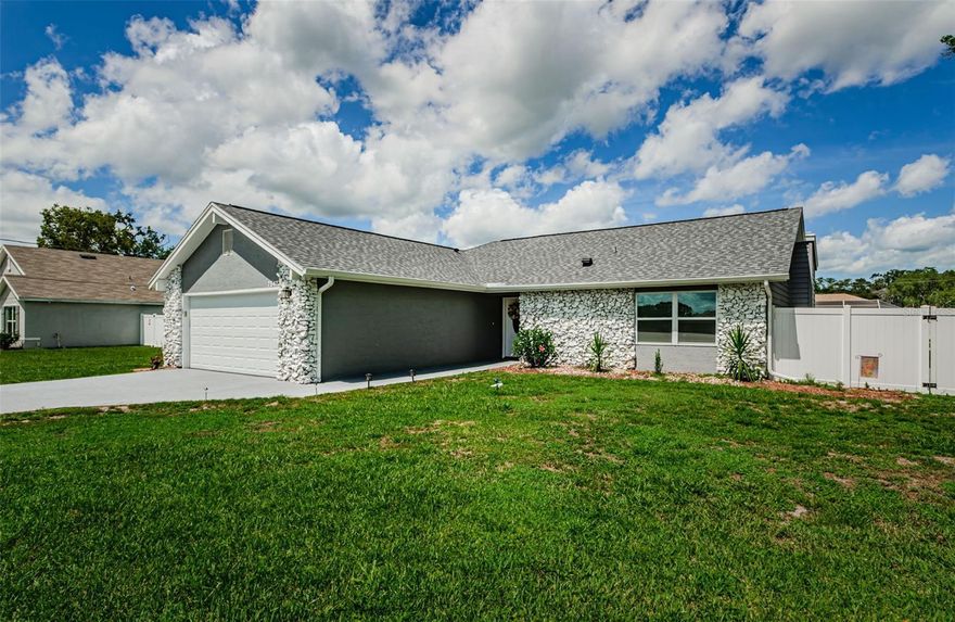 This beautifully updated 2-bedroom, 2-bath home offers 1,374 square feet of heated living space in a quiet, well-maintained neighborhood. Featuring a split floor plan and open concept layout, the home is perfect for both relaxing and entertaining. Everything has been updated. New roof, flooring, kitchen cabinets in 2024.The home also offers updated interior and exterior doors and new windows. Step outside to your private retreat with a heated saltwater pool in a screened-in enclosure, surrounded by updated landscaping that includes palm trees on each side of the pool. The expansive backyard is fully fenced with new vinyl fencing, offers a sprinkler system, and has ample space for a boat, RV, or recreational toys. A backyard shed provides additional storage. Inside, the spacious kitchen boasts stainless steel appliances, recessed lighting, plenty of cabinet space, a new silent dishwasher, heavy-duty garbage disposal and filtered water with a new softener system. The primary suite includes a custom walk-in closet and an en-suite bath with new walk-in shower tile and a generous bathroom closet. One of the secondary bedrooms features custom closet shelving. . This move-in ready property combines thoughtful upgrades with comfort and style, all in a desirable neighborhood you’ll love to call home. Sinkhole remediation was completed in 2012. Spring Hill offers a variety of activities for residents and visitors alike. Nature enthusiasts can explore the Weeki Wachee Springs State Park, known for its crystal-clear waters and live mermaid shows. For those seeking outdoor adventures, canoeing or kayaking down the Weeki Wachee River is a must. Golfers can enjoy several scenic courses, while families can visit the Wildlife Survival Sanctuary or take a trip to the beach at Pine Island. With its mix of natural beauty and recreational opportunities, Spring Hill promises something enjoyable for everyone. Don't miss out on your opportunity to own this beautiful updated home.