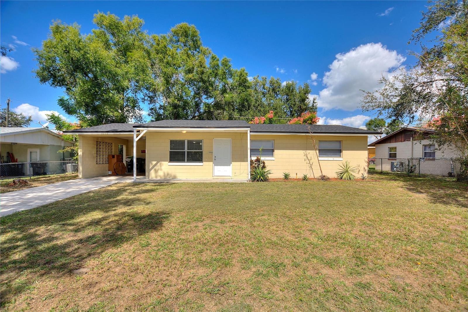 Come view this affordable 3 bed 1.5 home in the city of Bartow. Within a couple of miles if Winter Haven! Brand New Roof just installed! Laminate in main areas, tile in wet areas. New interior and exteriors doors. Freshly painted interior. Brand new water heater! Brand new electric panel! Sprawling fenced in front and rear yard. 1 car carport. Separate entrance that leads you to the spacious laundry room with washer/dryer hook up. Cute galley kitchen with range and refrigerator. Central AC only a few years old. NO HOA. Low maintenance living. Come view today!