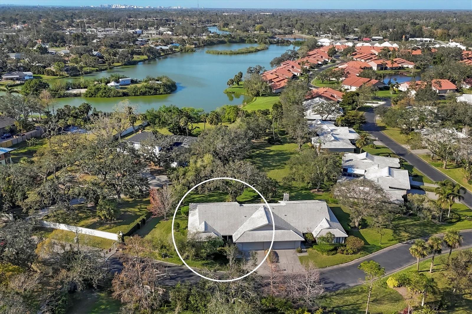 Welcome to Lakeshore Village South, a serene 55-plus pet-friendly community! Just minutes from the stunning Siesta Key Beach, this charming villa offers a relaxed, stress-free lifestyle with roof maintenance and landscaping covered in your quarterly fee. Experience the meaning of Florida living in a small, exclusive community with only 32 villas and a beautiful community pool. This rarely available is just 1 of 5 spacious villas in this community with three-bedroom, two-bath, two-car garage with an impressive 2,433 (includes covered lanai/sunroom) square feet and features versatile rooms that can be customized to suit your personal needs. Step inside through double front doors and be greeted by an expansive 27-by-18-foot living room with vaulted ceilings, creating an open and airy atmosphere. The large primary bedroom with dual walk-in closets for ample storage space. Many rooms throughout this home offer flexibility and the guest bedroom is set up as an office with built-in cabinets but could easily be converted to suit your lifestyle. The kitchen is equipped with a convenient passthrough window to the dining room and includes a cozy dinette area for your morning coffee. The attached laundry room provides plenty of cabinetry for additional storage. Enjoy the indoor-outdoor living with the lanai featuring all-around glass sliding doors and screens, giving you the option of fresh air or a comfortable sunroom retreat. For just $200 per year, residents can enjoy access to fantastic amenities, including two new pickleball courts, two tennis courts, a heated saltwater pool, a large clubhouse with a full kitchen and dining area, horseshoe pits and a billiards table. Don't miss out on this opportunity to live in a wonderful, low-maintenance community. Make this villa your new home today. Villa was repiped in 2015, New A/C in 2020, New tile roof is scheduled for replacement in 2026 by HOA