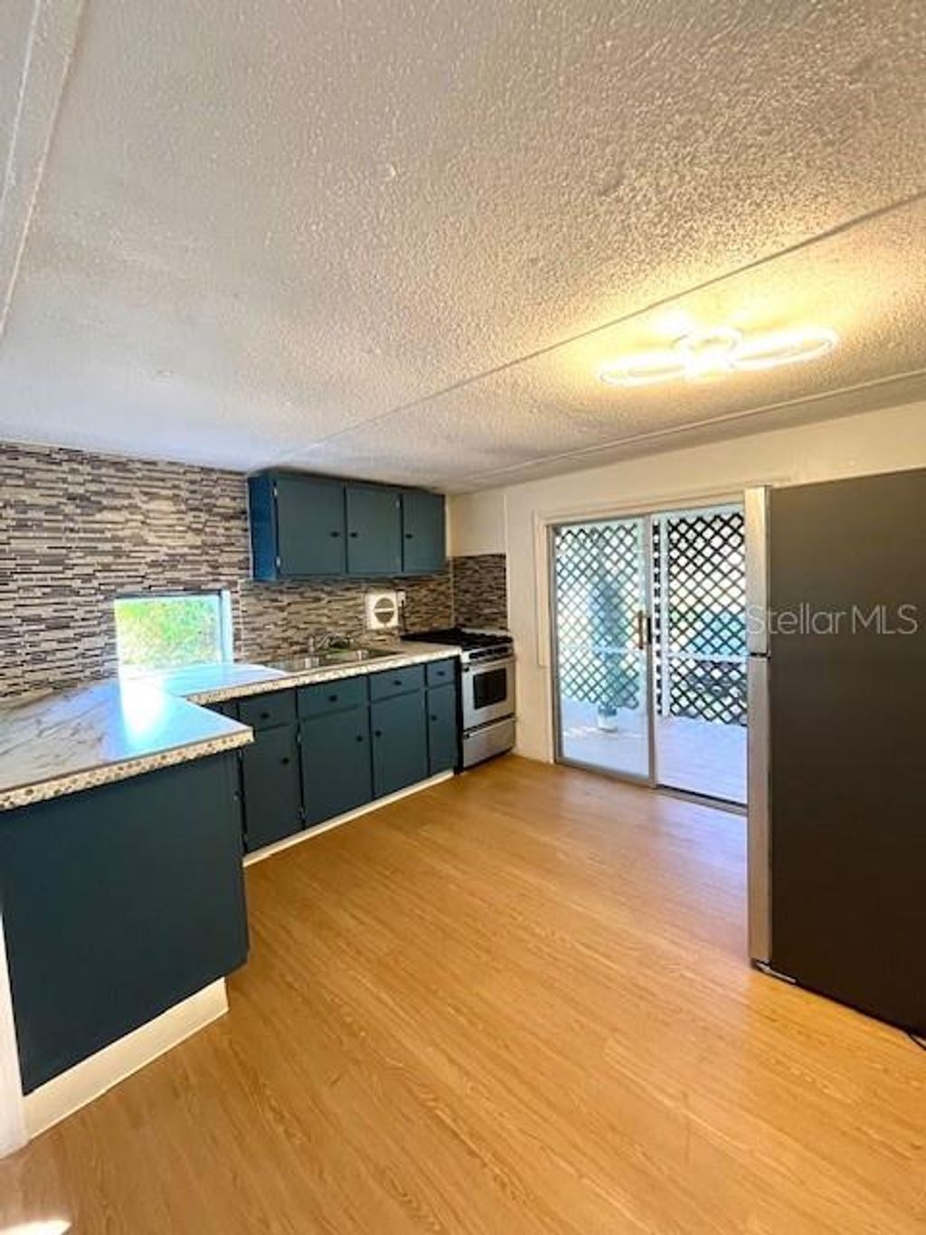 Photo of 207 Ketch Road, Saint Cloud, FL 34771 (MLS # S5138507)