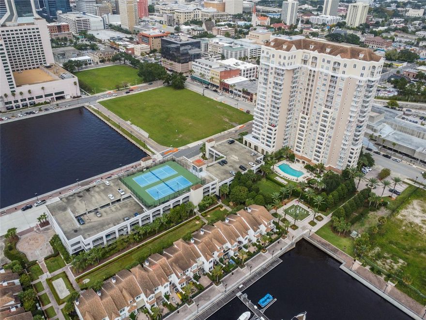 Experience riverfront living at its finest in this 1-bedroom, 1-bathroom plus den corner unit at The Plaza at Berkman. Unit #602 conveys with TWO parking spaces and offers breathtaking St. Johns River views from every room, including your private balcony. This well-positioned corner unit maximizes natural light and water views, featuring an additional den space ideal for a home office, guest room, or creative retreat. Enjoy a full lineup of amenities including: 24-hour concierge service, Resort-style pool with waterfront views, Bocce ball court for friendly competition, Tennis and pickleball courts, Outdoor kitchen with gas grills - perfect for entertaining, Relaxing Swedish sauna and steam room, Newly renovated state-of-the-art fitness center, Professional business center, Exclusive 21st-floor Riverview lounge, Climate-controlled wine lockers, Reservable guest suite for visitors, Full-service marina for boating enthusiasts. An unbeatable Location in the heart of Jacksonville's sports and entertainment district, you're just steps away from EverBank Stadium (home of the Jaguars) and VyStar Veterans Memorial Arena. Enjoy the ultimate urban lifestyle with premier dining, shopping, and entertainment at your doorstep. This exceptional unit is priced under market value and ready for your personal touch. Whether you're seeking a primary residence or investment property, this is your chance to own a piece of Jacksonville's coveted riverfront.