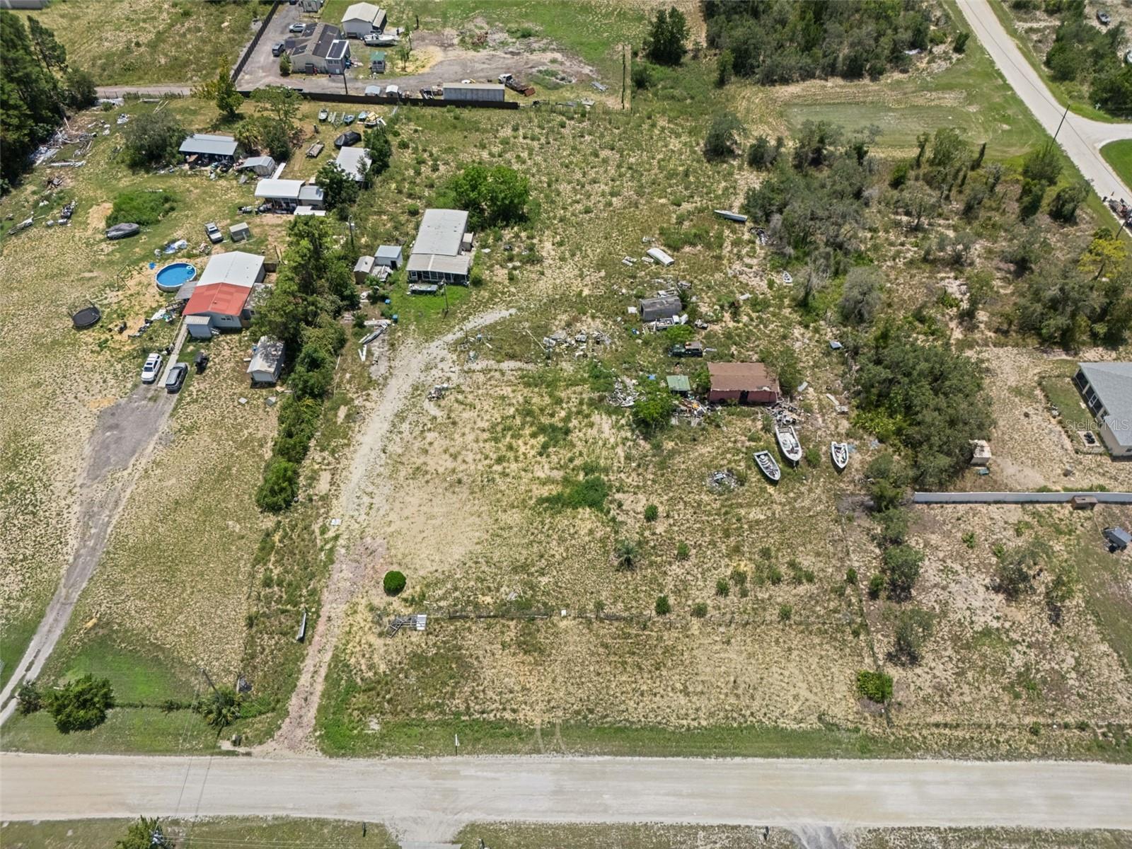 Tuck yourself away from the city chaos and hide out where the only traffic jam is caused by squirrels. This 1.3 acre slice of paradise has that “just-right" country feel — quiet, private, and full of potential. Once home to a mobile (may she rest in pieces), the land is now cleared but still comes with:
A shed ready to store your tractor… or hide from your in-laws
Power already running
Sewer connected
Well on-site (needs a little TLC — like most of us)
Bonus décor: a few “collector-quality” abandoned boats to remind you you’re not completely alone
Whether you're dreaming of a new manufactured home, tiny home, barndominium, or just a place where neighbors mind their own business — this is your chance to build your own private country heaven.
Warning: Side effects may include morning coffee with deer, growing an appreciation for overalls, and absolutely never going back to suburbia.