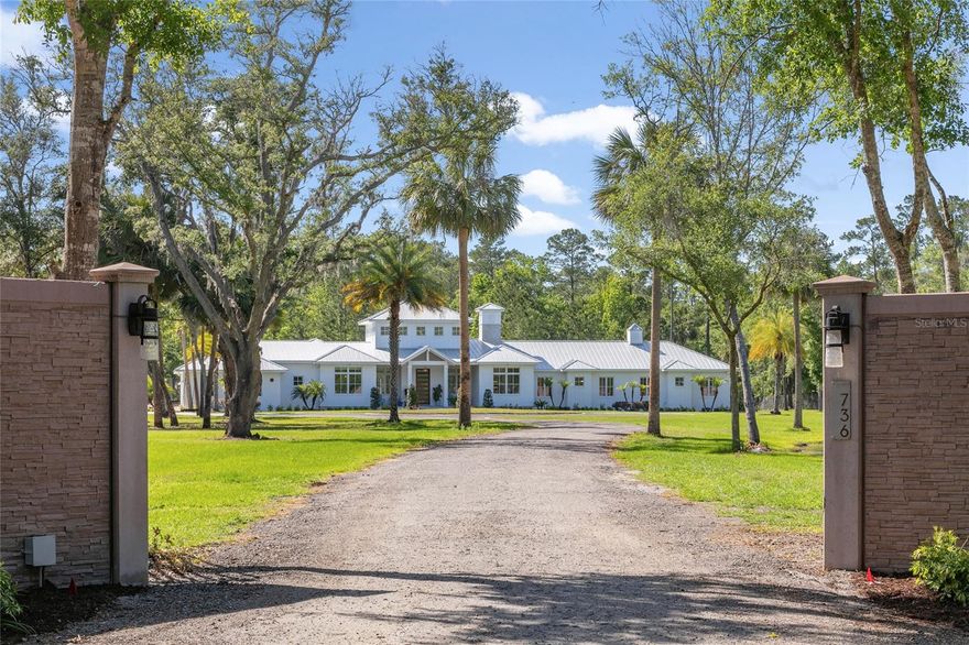 Alluring. Impeccable. Spectacular. This breathtaking five-acre estate resides peacefully along the Black Bear Wilderness Area, an expansive conservation area of nearly 300,000 acres of Florida forestry to explore or simply admire for a lifetime. Minutes from shopping, dining, golf, hospitals and everything Central Florida has to offer, the hidden community of Seminole Estates offers an incredibly secluded lifestyle without being too far away from the best of Lake Mary, Sanford, the attractions, the beaches and more, with no HOA. Fully fenced, this stunning, private oasis is tucked away down a long driveway past the 2/3-acre pond stocked with bass and ready for a lifetime of family memories. Enjoy fresh eggs daily, thanks to the chicken coop, ride recreational vehicles within the safety of the property or go out and explore, the opportunities are endless. Once through the gates, a remarkable sight comes into view. Newly constructed in 2019, this home enjoys the luxuries of museum-quality lighting, ultimate energy efficiency and stunning architectural features throughout. Soaring 28-foot ceilings in the great room welcome family and friends, scissor-panel doors completely open to seamlessly merge the lanai, great room and kitchen into an enormous alfresco retreat, easily accommodating 200 guests. Exquisite details are found in every corner of this magnificent home. The kitchen boasts wall-to-wall and floor-to-ceiling cabinets, featuring an inviting large center island, dual refrigerators and an impressive hidden pantry. A true chef's dream, Miele cooking and dual Sub-Zero refrigerators are a pleasant find. The master bedroom is sequestered away, enjoying tranquil landscape views, an expansive walk-in closet and a luxurious bath. After a workout in the gym, enjoy a soothing steam room treatment or slip into the regulation lap pool, then warm up in the 12-seat hot tub. The lifestyle opportunities are unending. Following the gallery hall, we find bedrooms two and three, both suites with private baths while bedrooms four and five share a Jack-and-Jill bath, all enjoying walk-in closets. A few steps away is the bonus room, pool bath and exercise room. The office is conveniently located, and the craft room adds a playful touch to this elegant home. A large brick paver parking area flanks the extremely spacious four-plus-car garage, opening to the mudroom adjacent to the oversized laundry featuring lots of cabinets, great counterspace and a pet shower. Ideally situated within moments of boutique shopping and dining in both Historic Sanford and Lake Mary, this modern farmhouse masterpiece is equally convenient to major hospitals, the attractions, and the beaches via the new 429/417 beltways, and I-4. Don't miss the incredible video and 3D tour. Room Feature: Linen Closet In Bath (Primary Bathroom).