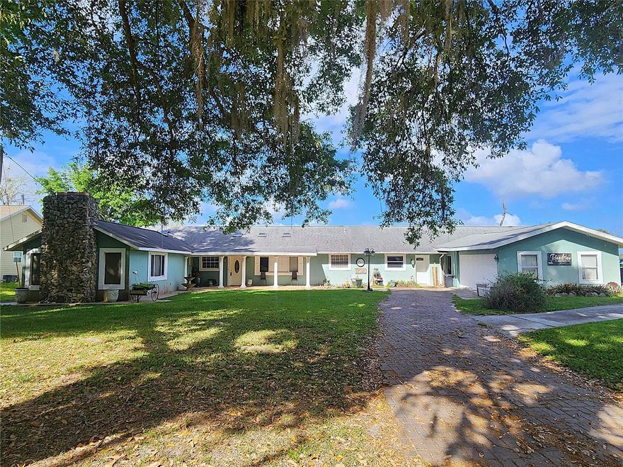 Welcome to beautiful Island Lake! This spacious 4 bedroom, 4 bath home features a screen enclosed solar heated pool, a 2 car garage, a concrete boat ramp and 2 docks - one of which includes a shade canopy for fishing or just enjoying the lovely lake views. The interior offers an oversized kitchen with granite countertops, abundant cabinetry and an island overlooking the large dining area and living room. Two generous bedrooms are on the left side of the home, each with its own private bathroom, a walk-in closet, and a fireplace - excellent space and privacy for extended families. On the right side, a third large bedroom overlooks the lake and includes a private bathroom. Its extra large size makes it ideal for use as a game room or family room if preferred. A fourth bedroom, a centrally located guest bathroom, and an indoor utility room complete the floor plan. New well pump, new roof in 2019, updated a/c units. The property is situated on a quiet dead-end road with a circular driveway for easy access. Conveniently located between Ocala, Gainesville and Palatka.
