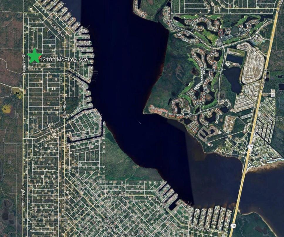 Photo of 12102 Mcelroy Avenue, Port Charlotte, FL 33981 (MLS # O6450229)