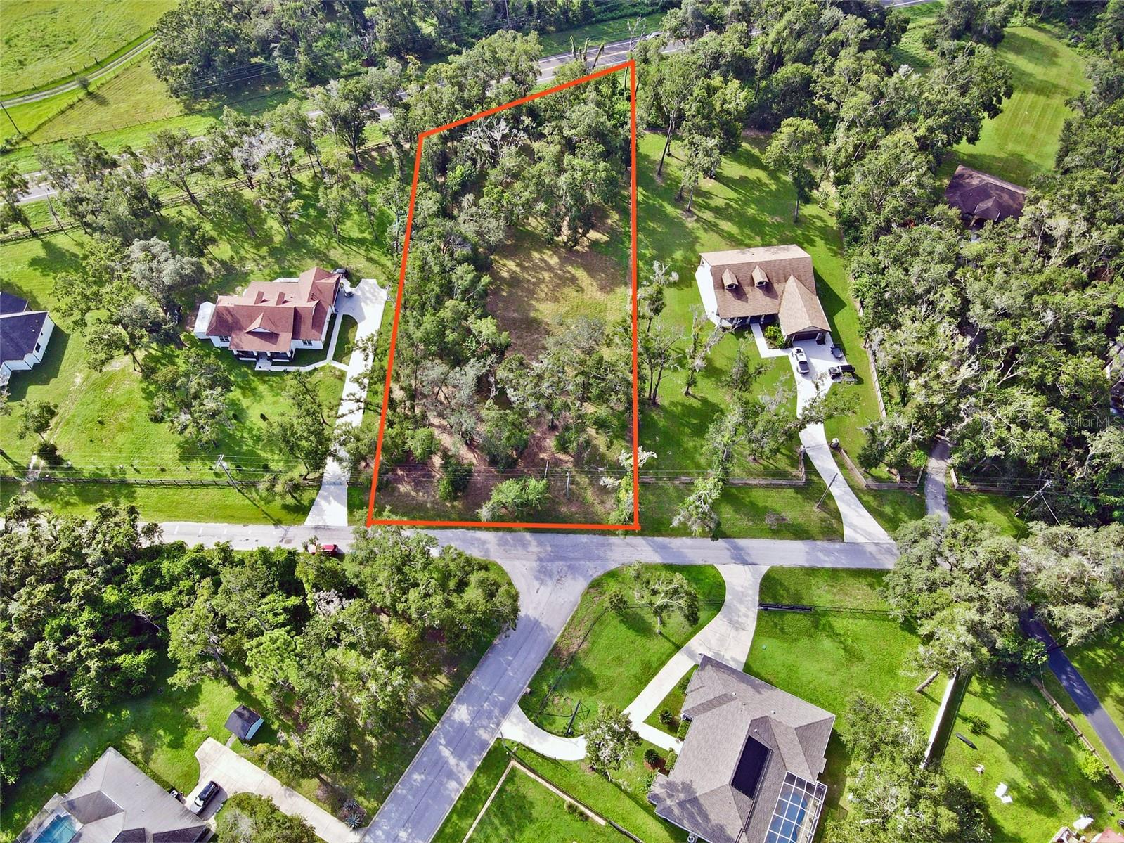 Build your private estate on 1.2 acres in the rolling hills of Dade City. This high-and-dry homesite rests in Flood Zone X, offering peace of mind and lasting stability, while no HOA means the freedom to design a residence as unique as your vision. With ample room for a sprawling custom home, pool, and even a guesthouse or in-law suite, the possibilities are endless. Mature oaks frame the property in natural beauty and privacy, while lightly cleared frontage makes access and build prep easy.
Utilities are nearby and septic is required, so the groundwork is set for your future build. Perfectly positioned near Lake Jovita Golf & Country Club, St. Leo University, the Mirada Lagoon, and historic downtown Dade City, this location blends small-town charm with modern convenience. Just minutes to Wesley Chapel and less than an hour to Tampa or Orlando, you’ll enjoy seamless access to shopping, dining, and entertainment while retreating home to the quiet luxury of the countryside.
For added peace of mind, we work with lenders experienced in land loans and with builders approved for construction-to-perm financing—available to assist in designing and building your new home if desired, though there is no obligation.
This is more than land—it’s the canvas for your forever home and the beginning of your legacy.