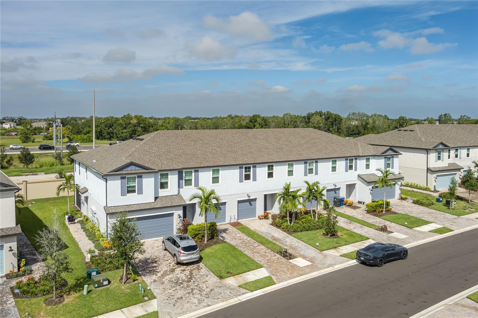 Welcome to Trevesta!
This beautifully designed 3-bedroom, 2.5-bath townhome with a 1-car garage is located in one of Parrish’s most sought-after gated communities.
The home showcases numerous upgrades including plank ceramic tile flooring, a gourmet kitchen, impact windows, barn doors, ceiling fans, and a saltwater water softener system. A screened, covered patio offers the perfect spot to enjoy natural light and stunning Florida sunsets.
Upstairs, the spacious primary suite features a walk-in closet, a private bath with walk-in shower, and a separate water closet. The two additional bedrooms share a full guest bath with dual sinks, while the conveniently located laundry room completes the second level. On the main floor, a half bath is ideal for guests.
Trevesta offers residents a resort-style lifestyle with amenities that include a sparkling pool, clubhouse, fitness center, and playground. Its central location provides easy access to Bradenton, Sarasota, Tampa, St. Petersburg, and the Gulf Coast’s beautiful beaches.
Please note: No sign is posted at the property.
