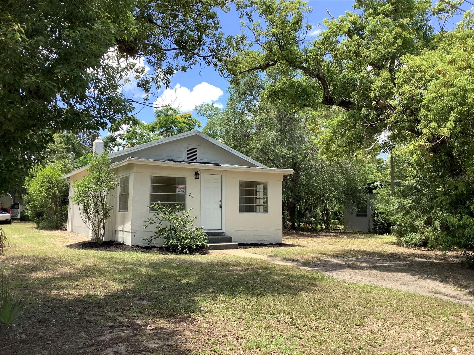 Cute remodeled bungalow in downtown Eustis on a nice corner lot with a variety of mature vegetation and a backyard shed. There is plenty of room to park several vehicles. A new refrigerator will be installed prior to closing. Owner financing available with a large down payment. This property is convenient to downtown area, a variety of businesses, shopping and close to Mount Dora and Tavares. Multiple parks and scenic chain of lakes features a variety of recreation.