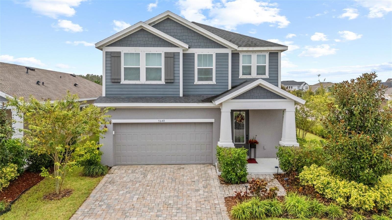 Stunning David Weekley Kingsbridge Model! Welcome to this elegantly designed move-in ready corner property offering both privacy and an expansive outdoor space. Thoughtfully crafted with comfort and convenience in mind, this home features a tandem garage, providing extra room for vehicles, storage, or hobbies. Step inside to discover a bright open-concept floor plan that blends style and functionality. The gourmet kitchen is a chef’s delight with a reverse osmosis system, upgraded faucet, whole-house water softener, and brand-new dishwasher, all designed to make daily living effortless. The spacious living areas are perfect for entertaining, filled with natural light and opening seamlessly to the lanai, complete with a gas hookup for outdoor grilling and gatherings. The primary suite is a true retreat, enhanced by a custom closet system and a designer accent wall that adds character and elegance. Additional upgrades include a wired security system, smart home touchpad control center, ground outlet, beautifully landscaped including professionally installed privacy hedges, and more, ensuring both comfort and peace of mind. Located in the highly sought-after Waterset community, you’ll enjoy access to resort-style amenities including multiple pools, state-of-the-art fitness centers, scenic walking and biking trails, dog parks, playgrounds, sports courts, and a welcoming community café. With its prime location, extensive upgrades, and lifestyle-driven amenities, this home offers everything you’ve been searching for. Schedule your private tour today and experience Waterset living at its finest!