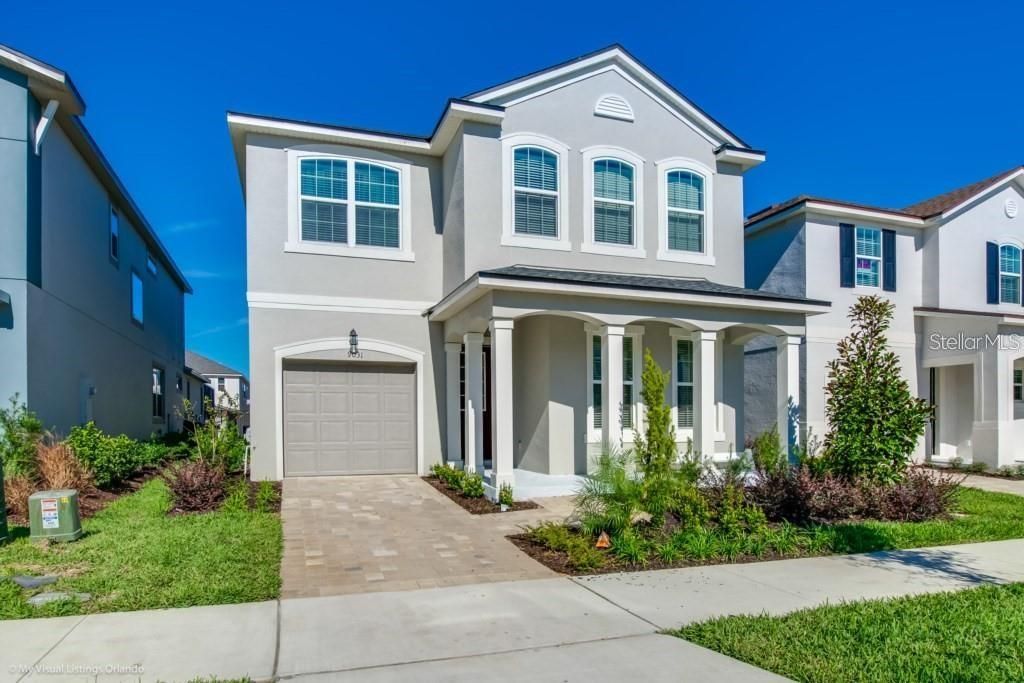 Photo of 9031 Pelican Cove Trace, Kissimmee, FL 34747 (MLS # O6385768)