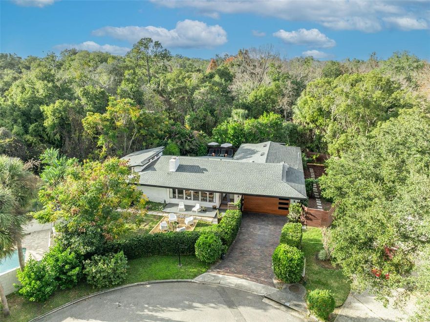 SERENE HOME in beautiful Dommerich Estates.  Located on a quiet cul-de-sac, this unique .28+ acre property offers a single story, 4 bedroom + flex room split plan surrounded by peaceful nature.   Brick driveway invites you to a gated courtyard leading to front door & fenced property offering complete privacy including pool, tranquil haven overlooking lush preserve & side yards for garden/play.  Step inside to experience spacious foyer & living room with wood burning fireplace & wall of windows to front courtyard.  The primary suite boasts a flex room perfect for home gym, office or nursery leading to 21x 14 primary bedroom!!  Bright kitchen overlooks sparkling pool & family room leading to additional three bedrooms & guest/pool bath.  This delightful home offers so much natural light, great closet space, hardwood floors, 2 car garage, new roof, gutters, AC, ductwork 2018, NO HOA!, Dommerich Elementary, Maitland Middle & Winter Park High & access to boat ramp on Lake Minnehaha leading to the Winter Park Chain of Lakes.  WELCOME HOME!