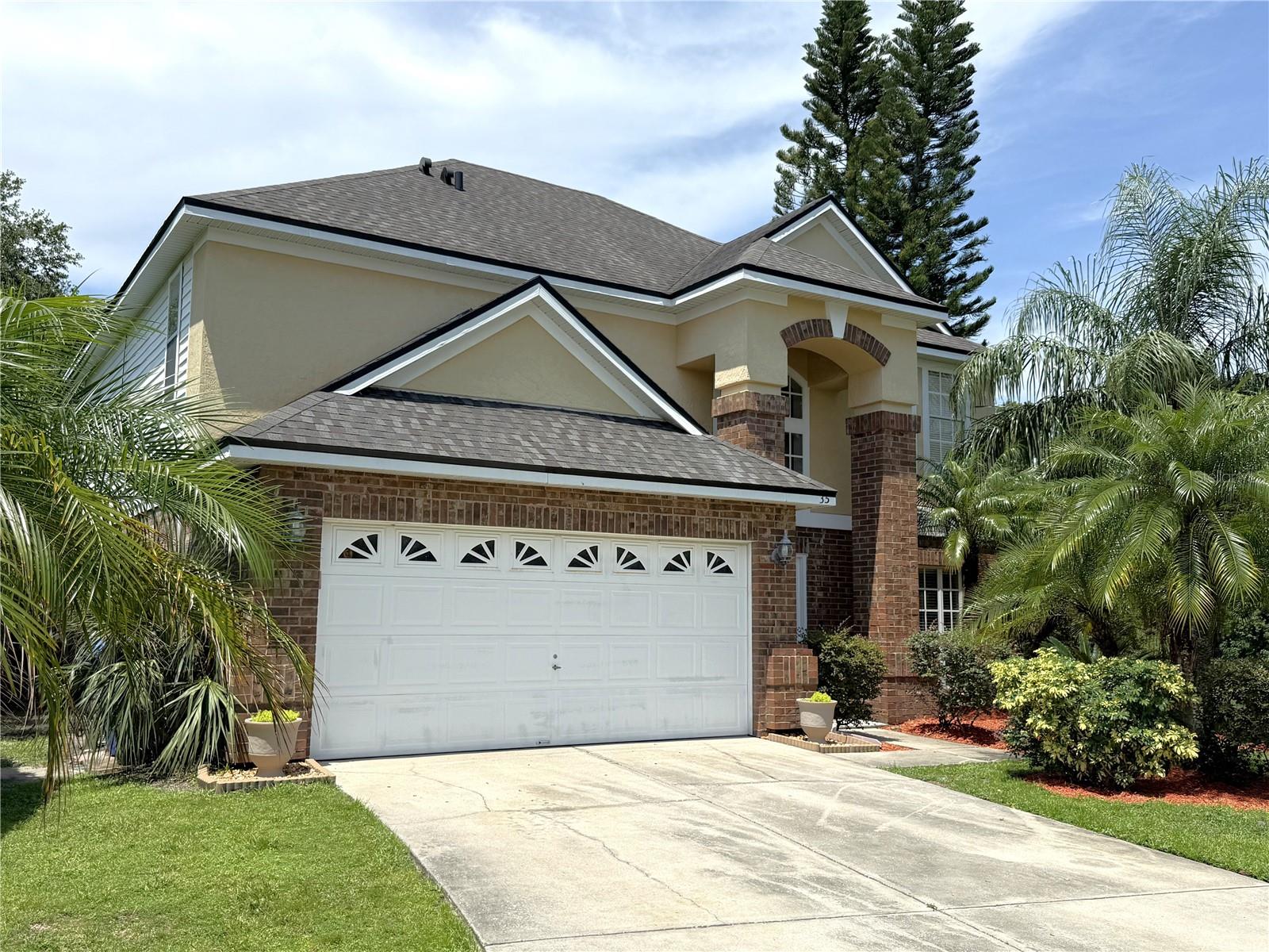 Incredible MOVE IN READY home located in Oviedo! Welcome to this stunning home nestled beneath the shade of majestic green trees, and a spacious backyard designed for peaceful moments. Whether you’re sipping coffee under the covered patio at sunrise or enjoying quiet evenings under the stars, this home is your private retreat. From the moment you arrive, you’ll be greeted by a beautifully landscaped front yard and impressive brick columns framing the entrance. Step inside to soaring ceilings and a stunning view of the upstairs balcony, setting the tone for the elegance throughout. The main level offers two inviting living areas with stylish luxury vinyl and crown molding. The front living room is thoughtfully designed with beautiful cabinetry and shelving, great for storage. The second living area is spacious with a ceiling fan and a charming peek-through cutout into the kitchen—perfect for staying connected during gatherings. The kitchen is a chef’s delight with a pantry, dual sink positioned beneath a window overlooking natural scenery, and Whirlpool appliances. Sliding glass doors open seamlessly to the covered patio, creating an ideal indoor-outdoor flow. Host unforgettable dinners in the formal dining room, illuminated by an elegant chandelier. Upstairs, generously sized bedrooms include walk-in closets and ceiling fans to keep cool on warm Florida days. The guest bathroom features dual access from both the hallway and a private bedroom, offering added convenience. The laundry room connects to a deep master closet that leads you to the spacious master suite—complete with his-and-hers sinks, a soaking tub, and a separate glass-enclosed shower. With timeless charm, thoughtful design, and tranquil surroundings, this home is a rare gem located in Seminole County and is zoned for some of the highest rated public schools in the state. Just minutes away from the 417, shopping, dining, neighborhood parks, and less than an hour to Florida's most beautiful beaches and world-renowned theme parks! Don't miss your chance to own this perfectly located and gorgeous home! Schedule your private showing today!