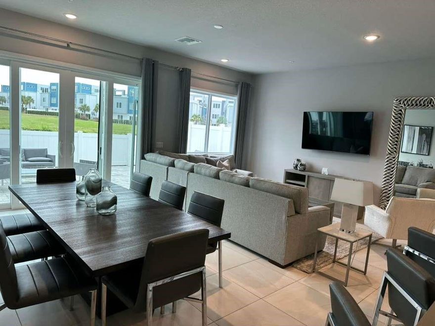 Discover luxury living at its finest in this stunning 4-bedroom, 3-bathroom vacation condo located in the exclusive Spectrum+ at Reunion Resort. Perfectly situated to unparalleled access to the entertainment, shopping, and world-class golf courses in the greater Orlando area, this property is an ideal addition to your portfolio. The expansive floor plan provides ample space for relaxation and entertainment. With a modern, open-concept design, the living area flows seamlessly into a gourmet kitchen equipped with high-end appliances and plenty of cabinetry. Each of the five bedrooms is a serene retreat, featuring large windows that flood the rooms with natural light. The primary bedroom on the first floor boasts a luxurious en-suite bathroom with dual vanities, a walk-in shower, and a private water closet. Upstairs, the loft/flex space leads to an expansive outdoor area with stunning views, perfect for al fresco dining or unwinding after a day of fun. This level also includes an additional bedroom and bathroom, offering extra privacy and comfort for guests. The on-site amenities resort amenities include a clubhouse with a game room and concierge services, ensuring all your needs are met, a state-of-the-art fitness center, resort-style pool with cabanas, a fantastic kiddie waterpark, miniature golf and an internal golf-cart transportation service. Choose from six resort restaurants, relax at any of the ten community pools, or take advantage of the complimentary transportation to Walt Disney World and around the Kissimmee area. Just 10 minutes to Disney and 30 minutes to Orlando International Airport, this condo is perfectly positioned for both convenience and excitement. Whether you’re seeking a relaxing retreat or an action-packed adventure. From its ease of maintenance to a highly-desirable location and unrivaled amenities, this luxury vacation condo represents the perfect blend of comfort and convenience. Don’t miss out on this incredible opportunity to own a piece of paradise in the heart of Orlando!