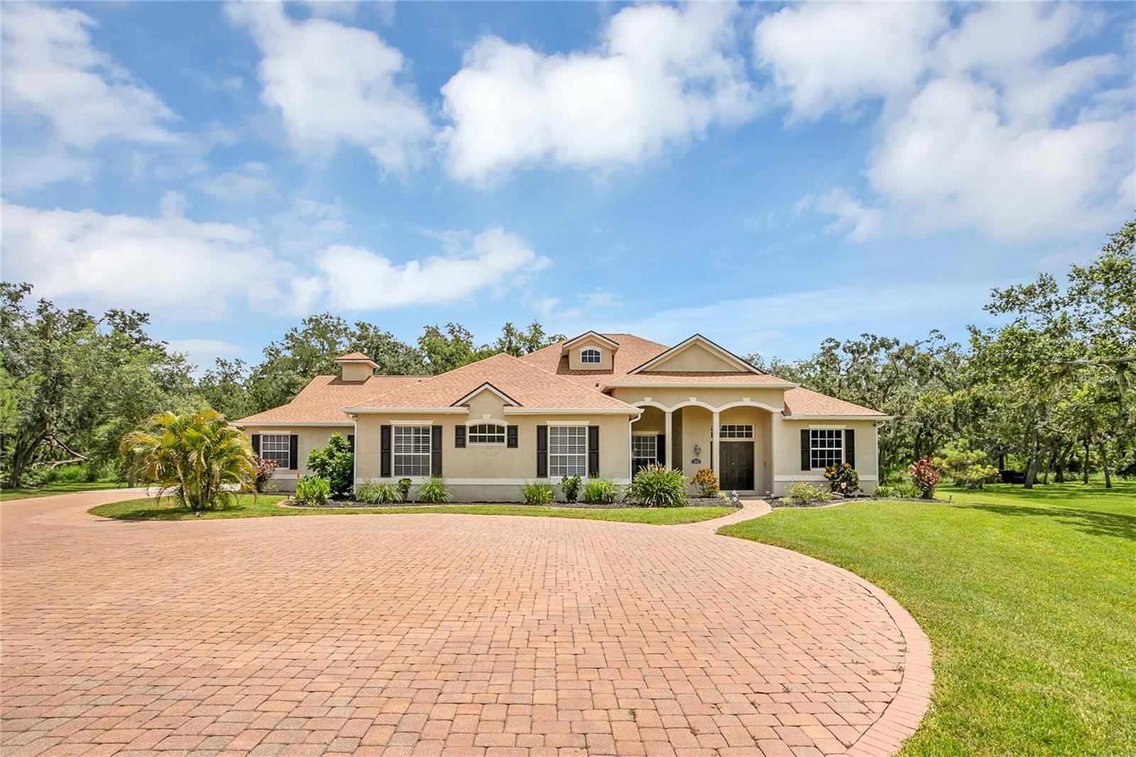Custom-Built Retreat on Over an Acre with Pool and Wildlife Views! Tucked away at the end of a quiet cul-de-sac, this one-of-a-kind, custom-built home is a rare gem offering privacy, charm, and space to breathe. Situated on just over an acre of beautifully wooded land, this 4-bedroom, 2 full bath, 2 half bath residence blends modern comfort with natural beauty. Step inside to discover a spacious open-concept layout, perfect for entertaining or enjoying quiet evenings at home. The heart of the home features a bright and airy kitchen that flows seamlessly into the dining and living areas, all overlooking your private backyard oasis. Out back, a sparkling pool invites relaxation, while deer often wander through, creating a peaceful, almost storybook setting. Feed and watch them from your patio — it’s a daily delight! A new roof installed in 2022 offers peace of mind, and thoughtful touches throughout the home make it as functional as it is beautiful. There's also a buried propane tank which fuels the fireplace but also has a hookup outside the pool bath to provide the possibility of an outdoor kitchen with grill in the future. With generous bedrooms and bathrooms, and plenty of room to spread out, this property checks all the boxes for those seeking space, serenity, and something truly special. Don’t miss this rare opportunity to own a slice of nature with all the comforts of home. SAVE BIG: 1% lender credit (based on loan amount) toward closing costs or rate buy-down with seller’s preferred lender. Ask for details!