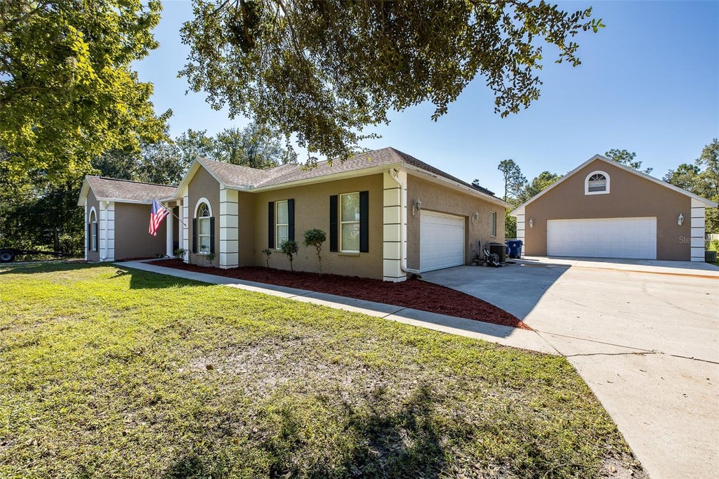 Photo of 31524 Cross Creek Lane, Wesley Chapel, FL 33543 (MLS # TB8557412)