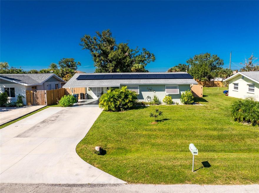 Lovely and ENVIRONMENTALLY CLEAN home, located on a pleasant and quiet dead-end road and  located in flood zone X, the safest designated flood zone to avoid flooding and also, NO flood insurance is required. This seller has established the home for restful, harmonious ambience and it has been set up as a healing sanctuary. The home has been freshly painted inside and outside, with soft calming earth tones. The AC is new in 2022 and features a UV system specific to kill microbes. A water purifier has been installed,  designed to provide structured water, more beneficial and safer for consumption. The roof is new in 2020, and there are solar panels leased from FPL, to lower any environmental impact, contributing toward more green living. The counter  tops are granite, the cabinets are new, with soft-close drawers. The flooring is all new within one year, and porcelain wood-look, throughout the home. The dining area has windows on 3 sides, overlooking a back yard, replete with many organic trees. The back yard is an organic FOOD FOREST GARDEN. There are producing, banana, mango, papaya, loquat, sapodilla, mulberry, Jamaican Cherry, in all, there are 15 edible fruit and vegetable varieties.  The shed is 10' X 16' and is on blocks, on a  slab, is anchored, and has 1 window, and a metal roof, and a ramp entry.
There are impact windows on the South side of the home. From this peaceful sanctuary walk one half mile to Lemon Bay Park, a 250 acre conservation area with nature trails and a kayak launch. Downtown Dearborn Street is within close proximity, a 5 minute's drive. Downtown bistros, a Farmers Market, boutique shoppes, fine dining or casual outdoor organic cafes, and wine tasting too. Manasota Key and Gulf Beaches are an easy 10 minute's drive. Make this extremely clean, with so many green features, safe home yours, and join the casual elegance of Englewood Florida!