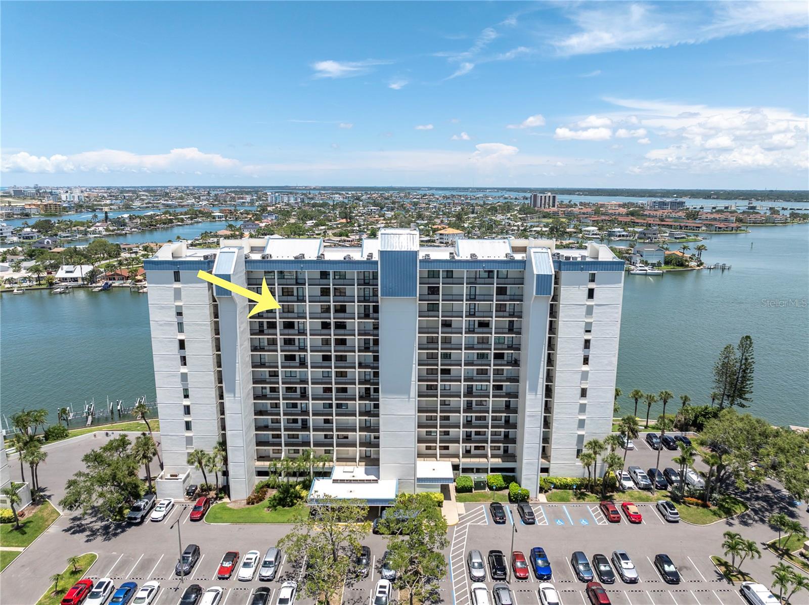 REMARKABLE BOATING – TENNIS – BEACH COMMUNITY with exceptional amenities! Located in the INTREPID BUILDING at ST PETE BEACH YACHT & TENNIS CLUB, this beautifully updated 11th-floor condo has gorgeous views of the Intracoastal Waterway and along the shimmering coast of the Gulf of Mexico from the balcony, and a sparkling view of St Pete Beach from front windows! Renovated and turnkey - beautiful kitchen with chic granite "leather" countertops with a matte finish, “soft close” shaker cabinetry, built-in storage, SS appliances, and an island for casual entertaining. HURRICANE SHUTTERS for peace of mind, along with plantation shutter and custom window treatments. Recessed lighting, textured walls and ceilings, plantation style entry closet doors, and the luxury plank vinyl flooring is easy care. Cheerful living space opens to a private patio and stunning views of miles of coastline. Tremendous primary suite with water views and balcony access, and large walk-in closet with an organization system. Primary bathroom has been fully renovated with new vanity, granite "leather" counters, lighting, cool tile shower and new tub. The guest bedroom is also sizable and boasts a built-in closet with an organizational system, and a fully renovated guest bathroom with frameless glass shower door, new appointments which coordinate with the décor and style of this renovated beauty. FURNITURE and FURNISHINGS AVAILABLE for a turnkey purchase experience. Milestone and Reserve Studies completed! The “like new” INTREPID BUILDING has been renovated, and all assessments have been paid. A new seawall project has also been funded. Yacht & Tennis Club, a 1st class gated community with extraordinary "something for everyone" amenities: marina with boat slips (individually owned by condo owners), 7 QUALITY Har Tru Tennis Courts with designated Pickleball court, 24-hour security and guard gate entry, renovated fitness center, renovated waterfront heated pool, whirlpool, barbecue deck, and gazebo dining area, men's & women's saunas and renovated clubhouse. The maintenance fee includes insurance on the building, water, trash, cable, INTERNET/WIFI, and all amenities. Walkability... stroll to the beach while passing restaurants, shops, and parks along the way. Strategically located waterfront community with quick access to the Gulf of Mexico or Intracoastal Waterway. Check out the video attached to this listing!