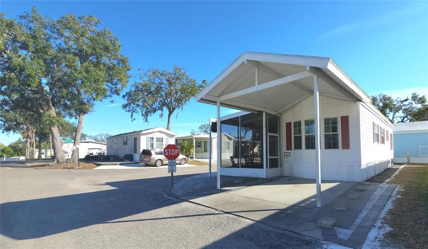 IF YOU ARE SEARCHING FOR A FLORIDA GETAWAY HOME, THEN THIS PROPERTY MAY BE FOR YOU! One bed, one bath mobile home in an active 55+ Community. Pet friendly! There is a den with built-in desk and storage that has an accordion-fold door that separates it from the dining area. This would make a great office. There are two pull-out sofa beds for guest sleeping options. All appliances included, carport, screened front patio, partially furnished, central A/C, & storage shed. Membrane roof replaced in 2022. Extra patio or parking space. Sugar Creek Villas is a gated community with HOA fees of just $600 per quarter. Fees include water, sewer, trash, grass mowing, basic cable, and internet. Amenities include: Two swimming pools, heated spa, clubhouse, laundry facilities, tennis & shuffleboard courts, fitness room, lending library, workshop, and social activities during the winter season. Home may be rented out for up to six months per calendar year after two years of ownership. What are you waiting for?