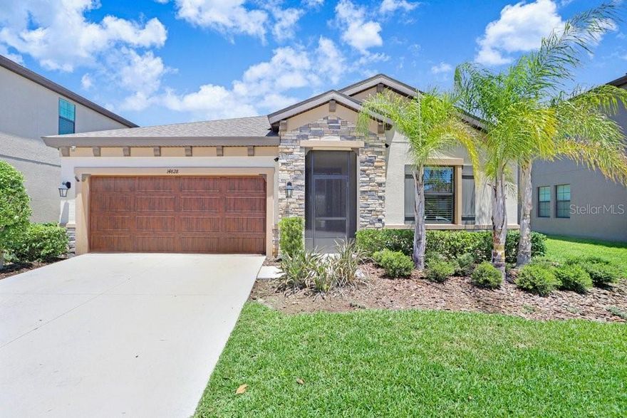 Welcome to this stunning 2022-built Homes by WestBay Sandpiper model, perfectly situated on a quiet dead-end street with serene pond views and no rear neighbors. Featuring impressive curb appeal with a stone front elevation and screened front veranda, this beautifully designed 3-bedroom, 3-bath home plus office offers both luxury and functionality.  Step through the elegant front door with tempered glass and iron detailing into a grand foyer with soaring 11-foot ceilings. Inside, you'll find upgraded 8-foot doors throughout, neutral finishes, abundant natural light, and wood-look tile flooring throughout the main living areas  The spacious office features glass-panel French doors, creating the perfect work-from-home space. The front guest bedroom offers generous space and a custom closet system, while the second guest suite includes a private en-suite bath with walk-in shower and a large walk-in closet.  The gourmet kitchen is thoughtfully designed with subway tile backsplash, wall oven and microwave, gas cooktop with stainless hood, pendant lighting, basin sink, and a walk-in pantry with frosted glass door. The open living and dining areas create an inviting space ideal for entertaining and everyday living.  The primary suite is filled with natural light and features dual closets, including a large walk-in closet. The luxurious en-suite bath showcases an oversized walk-in shower.  One of the home’s standout features is the incredible outdoor living space — an extended 680-square-foot screened lanai overlooking the peaceful pond with no backyard neighbors, creating a private and tranquil retreat.  Additional upgrades include an epoxy garage floor, overhead storage, and water softener/filtration system.  Residents enjoy exceptional community amenities including a resort-style pool, pickleball courts, shuffleboard, multiple playgrounds, and more.