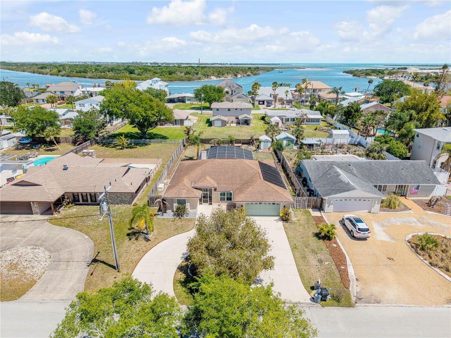 Well maintained 3Bd, 2Ba, 2Car Garage pool home in prestigious Inlet Shores neighborhood with NO HOA. The open concept area of living room, dining, and kitchen leads out to the screened pool and patio area. The triple sliding doors pocket to provide a full view of the beautiful back yard and pool. The kitchen binets, eat-in area and pantry. There is a screened in double entry front door and porch. Large primary suite with door to pool area, double walk-in closets and large en-suite bathroom. Front porch and pool area are paved.