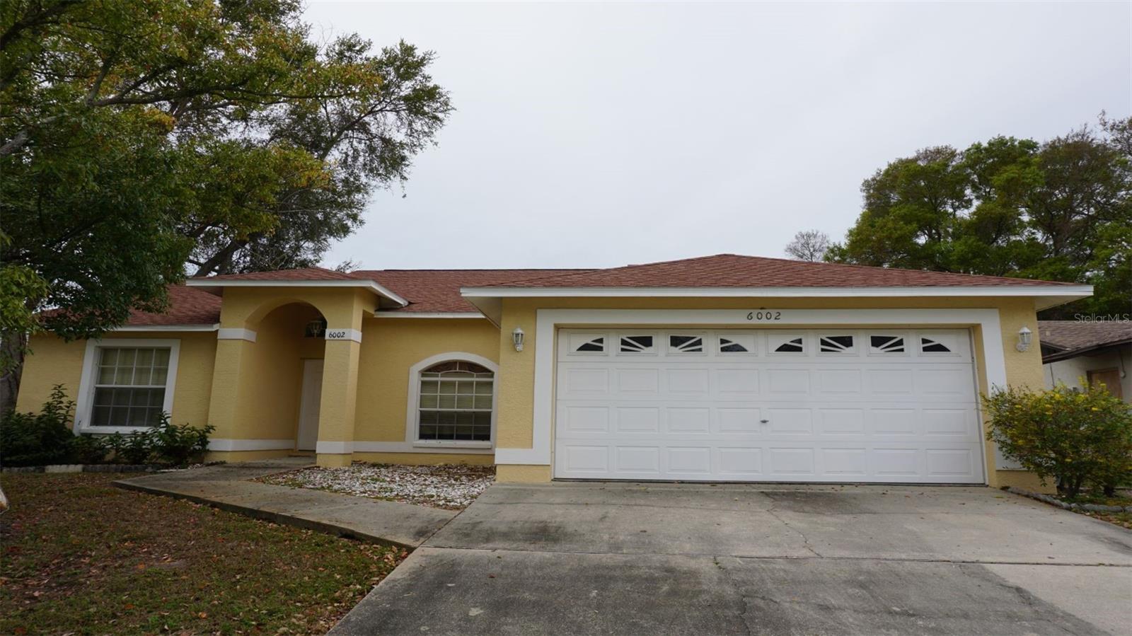 Beautiful 3 bedrooms, 2 baths, 2 car garage home, situated in BONNIE BAY SUBDIVISION. Features include 1524 heated sqft plus a screen room, airy open floor plan, laminated flooring in the living room and all bedrooms. A new shingle roof was installed in 2022. This home is in a nice neighborhood and convenient to many shopping stores, restaurants and minutes to Tyrone Mall. Easy access to I-275.