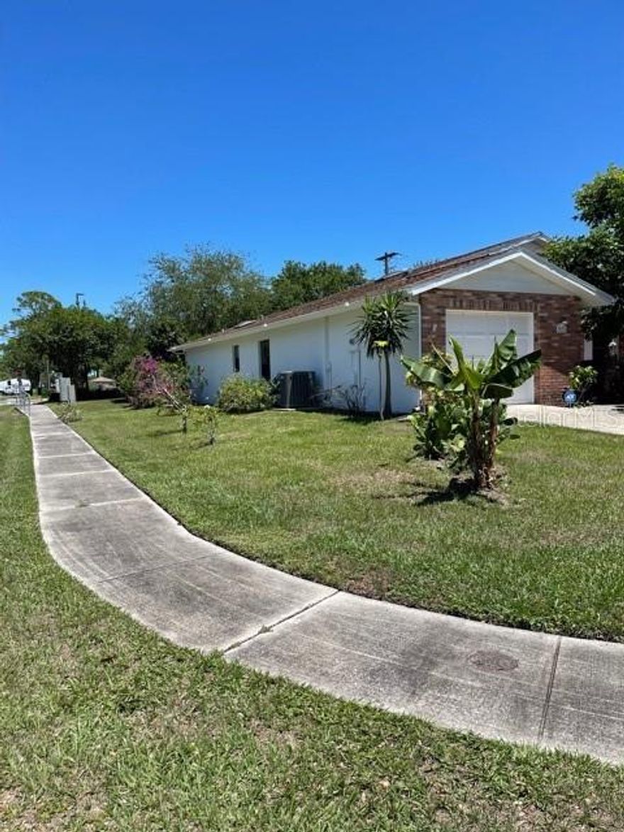 Move In Ready Shangri La Unit. Super cute 2 bedrooms & 2 baths  situated on a corner lot with newer carpet. This home features an enclosed back porch, a private back patio and  a 1 car garage with washer/dryer hookup . There is also a cathedral ceiling in the living room. Centrally located in Edgewater and close to everything you need including dining, the river walkway  and grocery stores. Schedule your showing now! Owner is in the process of moving so more photos will follow shortly. ;Water: City