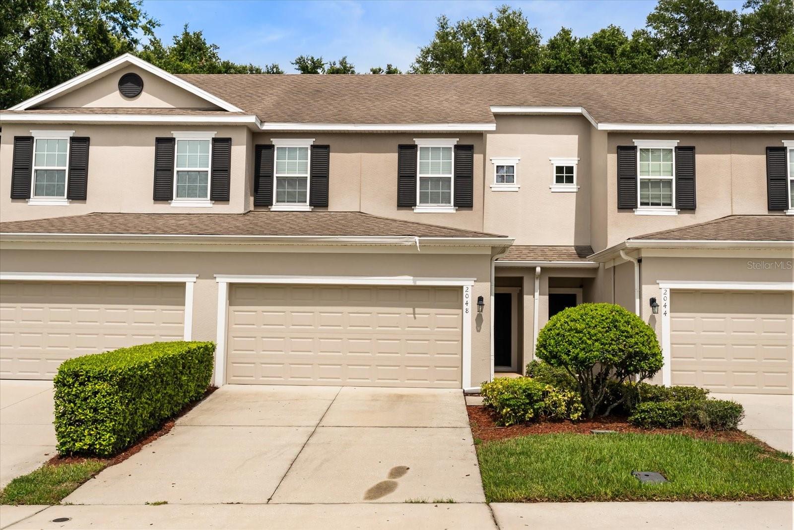 Welcome to easy living in Prairie Lake Preserve, a gated community in the heart of Ocoee, FL, offering premium privacy, nature views, and resort-style amenities. This two-story townhome features 3 bedrooms, 2.5 bathrooms, and an open floor plan designed for both comfort and functionality. Step inside to find a bright and inviting layout with tile flooring in the main living areas and plush carpet in the bedrooms. The kitchen is fully equipped with granite countertops, black appliances, and plenty of cabinetry—perfect for cooking and entertaining. The living and dining spaces flow seamlessly to the covered back patio, ideal for relaxing outdoors with tranquil views and no rear neighbors. Upstairs, the spacious primary suite boasts a huge ensuite bathroom, walk-in closet, and plenty of natural light. Two additional bedrooms and a second full bath present flexibility for family, guests, or a home office. Enjoy peace of mind and maintenance-free living with HOA-covered lawn care and exterior maintenance, plus access to community amenities including a sparkling pool, clubhouse, and park/playground. Surrounded by nature yet close to shopping, dining, and commuter routes, this is the perfect place to feel tucked away without being far from it all. Ready for comfort, convenience, and community? This Prairie Lake Preserve townhome has it all—schedule your showing today!