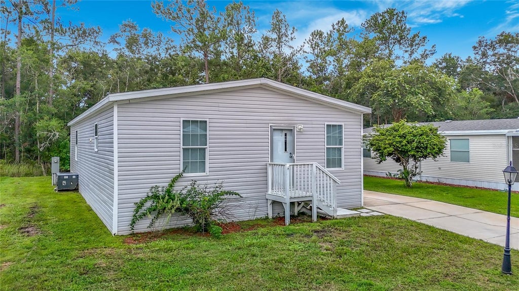 Photo of 2908 Kingswood Circle, Brooksville, FL 34604 (MLS # TB8553484)