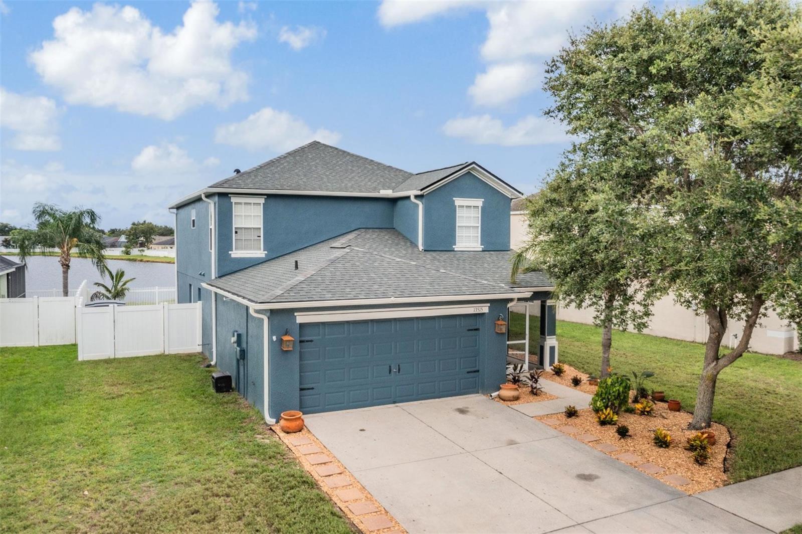 Welcome to this beautifully maintained two-story single-family home located in the highly sought-after South Fork community of Riverview! This spacious residence features a desirable layout with the primary suite conveniently located on the first floor, complete with a large walk-in closet. The kitchen is both functional and full of charm, featuring blue wood cabinetry, a brand-new refrigerator, and coordinating white appliances. A dedicated indoor laundry room adds extra convenience, no need to walk through it to enter the home. Upstairs, a versatile bonus room offers flexible space perfect for a home office, playroom, or media room. The secondary bedrooms are generously sized, offering comfort and privacy for family and guests alike. Step outside to a fully fenced backyard overlooking a peaceful pond ideal for relaxing or entertaining. Enjoy the extended cobblestone patio with a built-in fire pit, perfect for cozy evenings under the stars. A small utility shed provides additional storage, and banana trees add a tropical flair. The front yard showcases brand-new landscaping, creating stunning curb appeal, while additional exterior features include gutters and a new roof installed in 2025. Residents of South Fork enjoy resort-style amenities including a community pool, clubhouse, dog park, picnic areas, playground, soccer field, and basketball and volleyball courts. Conveniently located near top-rated schools, shopping, dining, and major highways, this home truly has it all. Don’t miss your opportunity to own this move-in-ready gem in one of Riverview’s most desirable communities. Schedule your private tour today! Some photos have been virtually staged