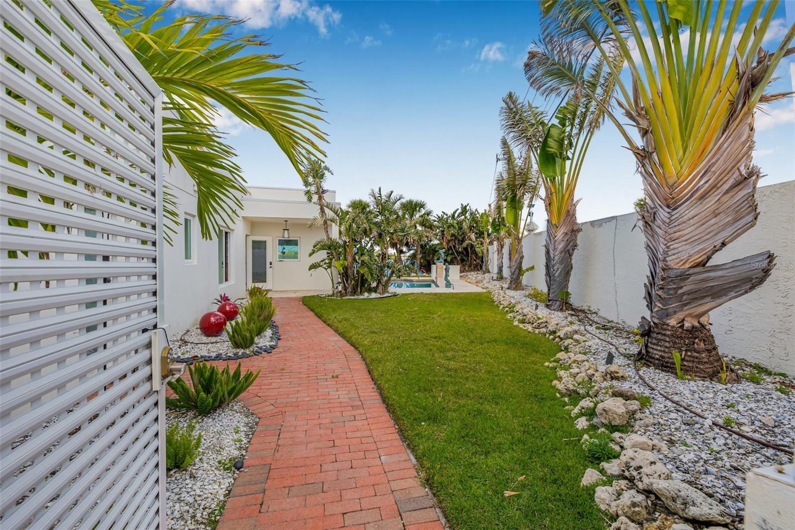MAJOR PRICE REDUCTION!!
Waterfront Gem – Steps to St. Armands, Lido Beach & the Future St. Regis | 7-Day Rentals Allowed. | Full Gulf Access | Boatable
This rare waterfront opportunity offers 87 feet on the wide section of Pansy Lagoon with a reverse pie-shaped lot that widens to approximately 152 feet deep, creating an ideal private backyard oasis. With Privacy walls surrounding the property you have all you need in water, sun and fun! Just a short walk to world-famous Lido Beach, the vibrant dining and shopping of St. Armands Circle, and the soon-to-open St. Regis Resort, this location is one of Sarasota’s most coveted. With 7-day rental eligibility, it’s perfect as a luxury retreat or income-producing investment. The home has been professionally remediated after storm-related water intrusion and taken down to the studs—The rebuilding is ongoing with expected completion date of mid June! Major updates include a new ductwork, Drywall in, updated electrical, and brand new pool equipment in 2025. The roof, windows, exterior stucco, and seawall were replaced in 2018, along with a new dock that simply needs to be reset. Electric hurricane shutters, remote privacy screens, and hurricane-rated shades were also added in 2018 for peace of mind. Picture yourself floating in the pool while dolphins play in the lagoon, then heading out on foot to enjoy award-winning restaurants like Columbia, Shore, Café L’Europe, and Crab & Fin. If you love to travel by boat head out to Marina Jack's, Dry Dock or Mar Vista just a short boat ride away! This property and area allow only private boat traffic. With incredible walkability, significant updates, and rental flexibility, this property offers unmatched potential in one of Sarasota’s most desirable waterfront neighborhoods.