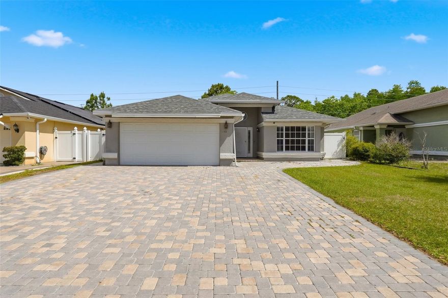 Step into comfort and style with this beautifully maintained 3-bedroom, 2-bath pool home that checks all the boxes. From the moment you arrive, you’ll notice the oversized brick-paver driveway and the cohesive paver design that wraps around the entire home, continuing seamlessly to the expansive pool deck—perfect for both everyday living and entertaining. Inside, the home features ceramic tile flooring throughout, offering a clean, modern look with easy maintenance—no carpet anywhere. The kitchen is a standout with granite countertops, solid wood cabinetry, and plenty of space for cooking and gathering. Step outside to your private backyard retreat, fully enclosed with a white vinyl privacy fence. The screened-in pool area provides the ideal setting to relax or host guests year-round, combining comfort with Florida outdoor living at its best. Whether you’re looking for a primary residence or a move-in-ready investment, this home offers a blend of quality finishes, thoughtful upgrades, and inviting indoor-outdoor living.